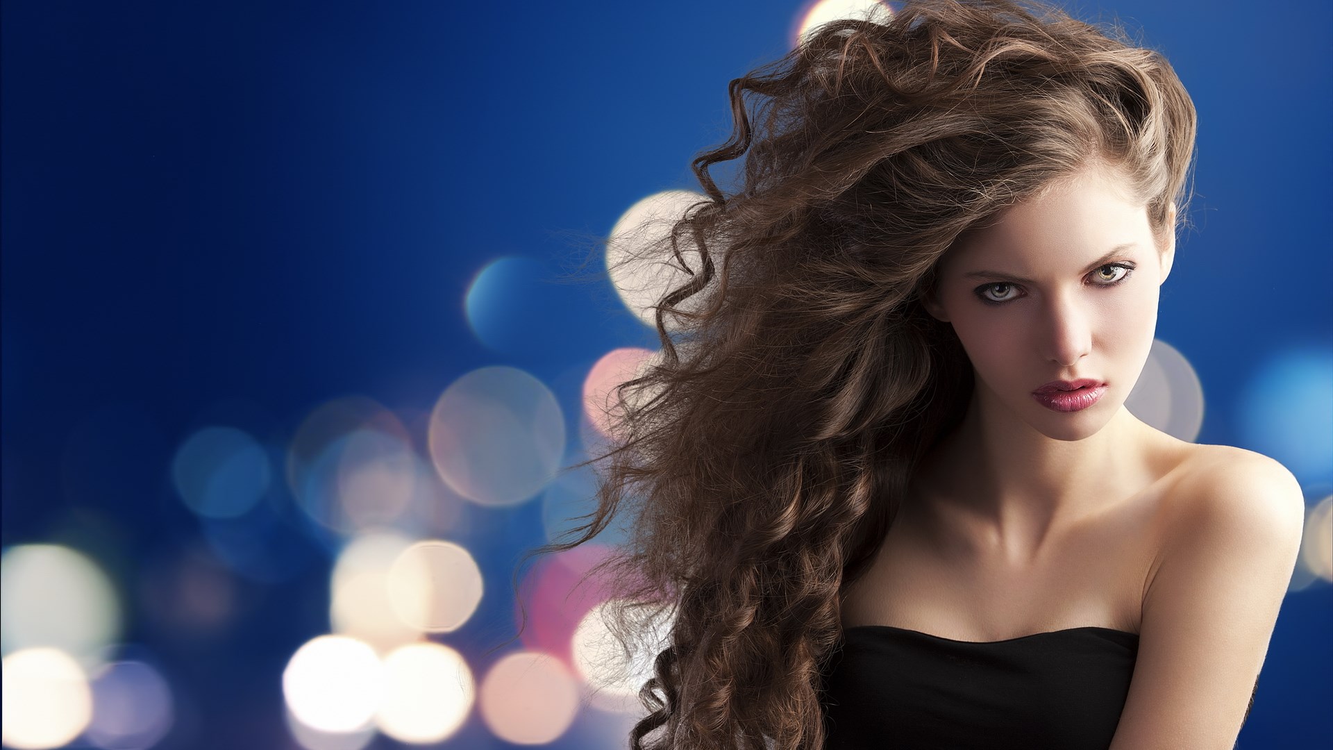 Woman with long curly hair and bokeh background HD Wallpaper