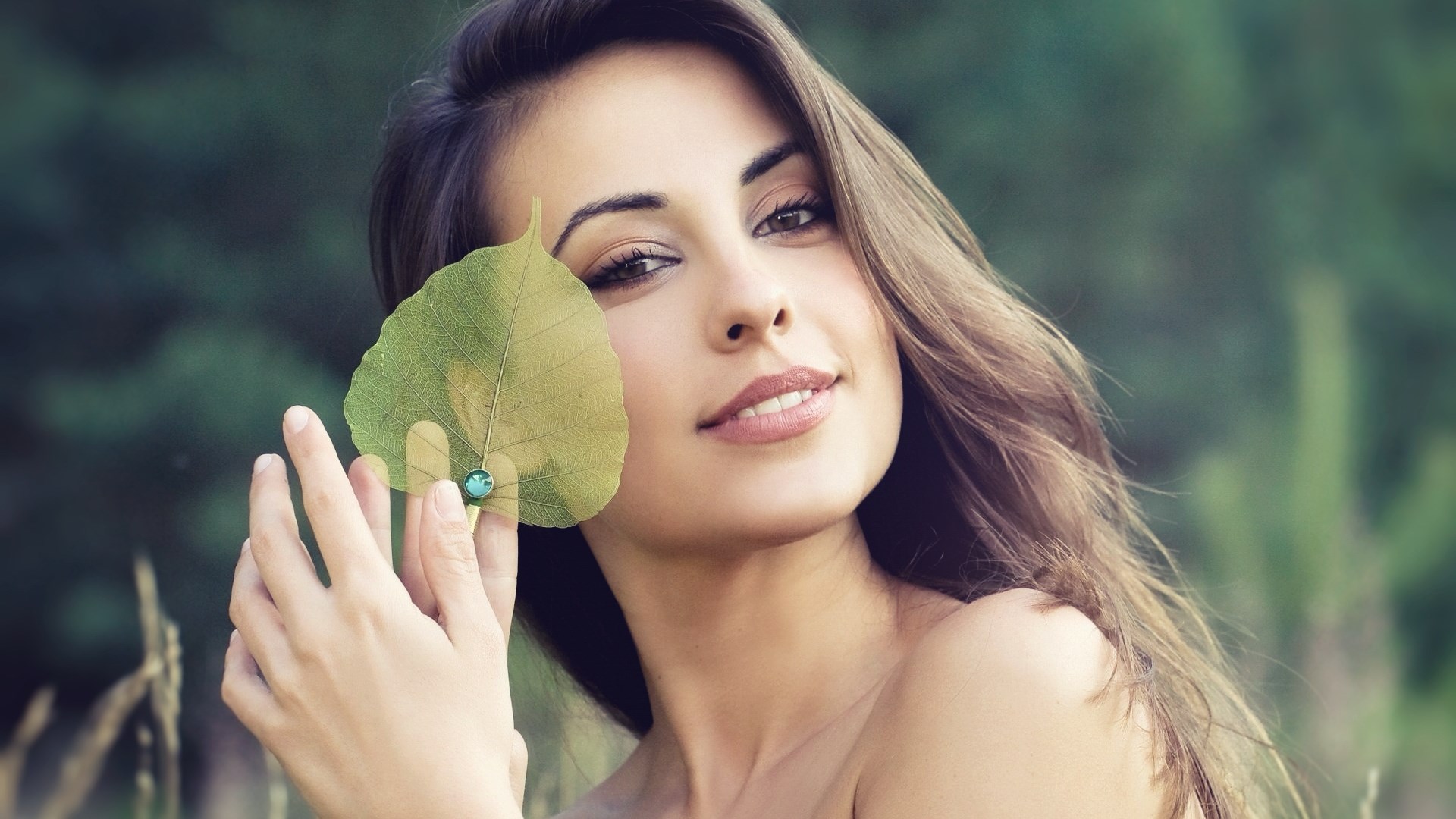 Woman holding a leaf with a jewel HD Wallpaper