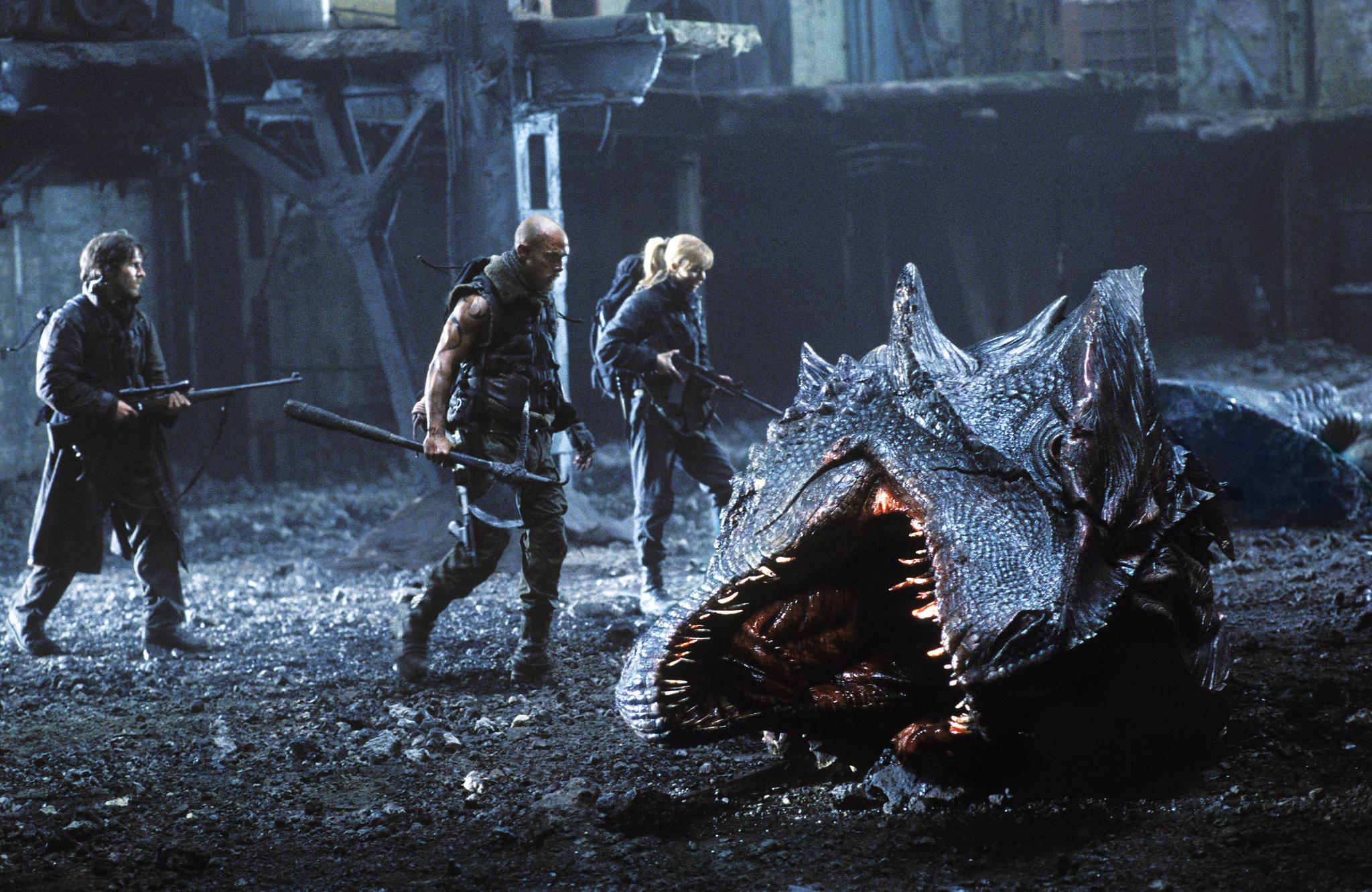 Matthew McConaughey and allies facing a creature HD Wallpaper