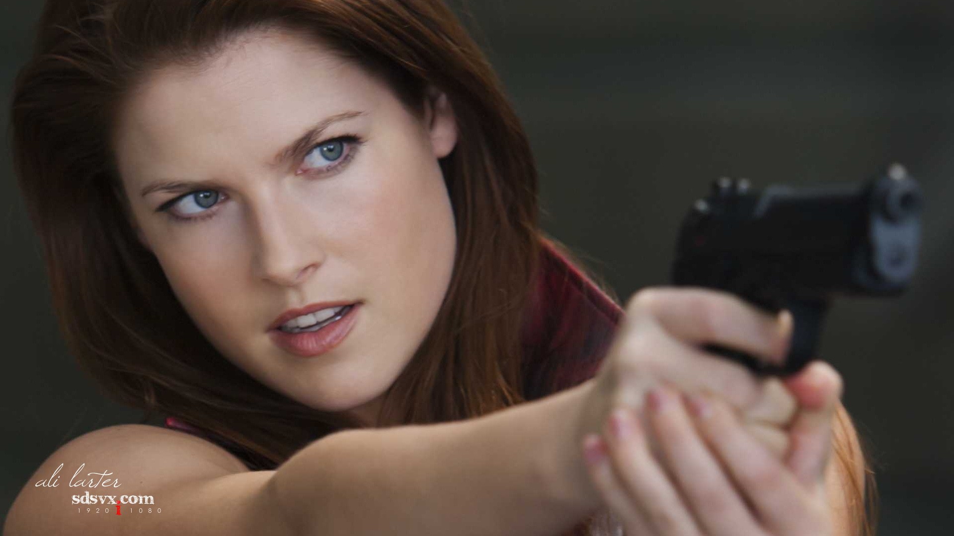 Ali Larter holding a gun HD Wallpaper