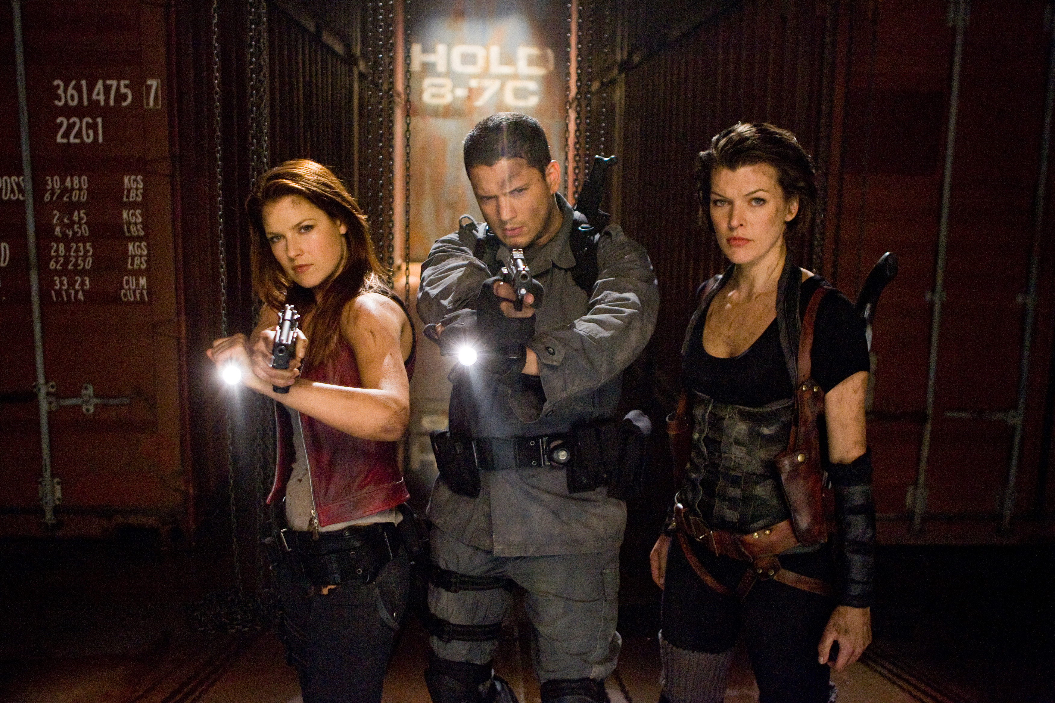 Ali Larter and two men with guns HD Wallpaper