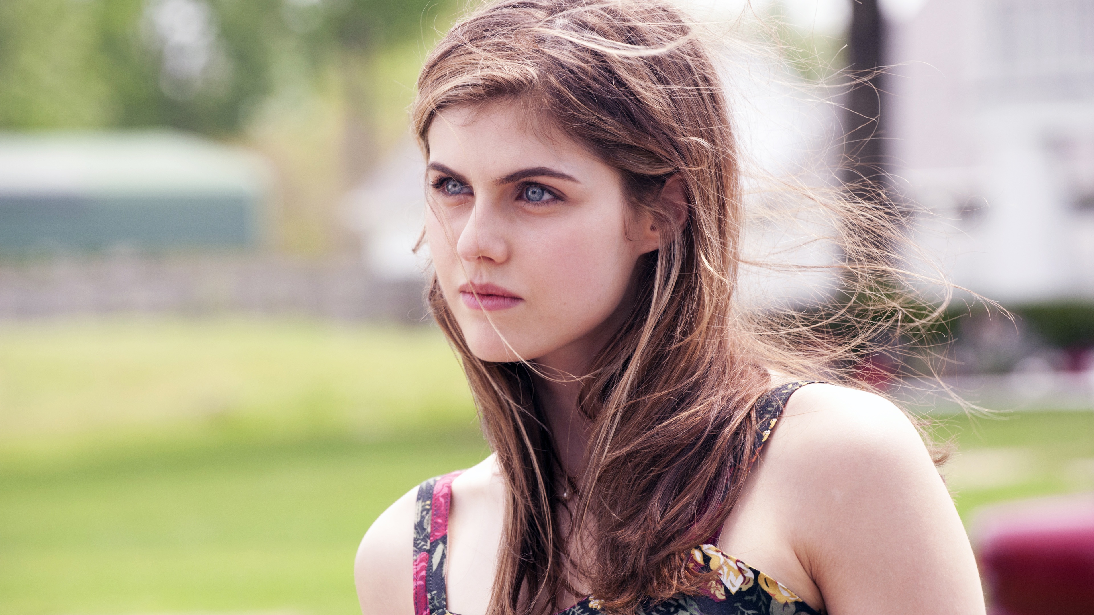 Pensive Alexandra Daddario with Flowing Hair Outdoors HD Wallpaper