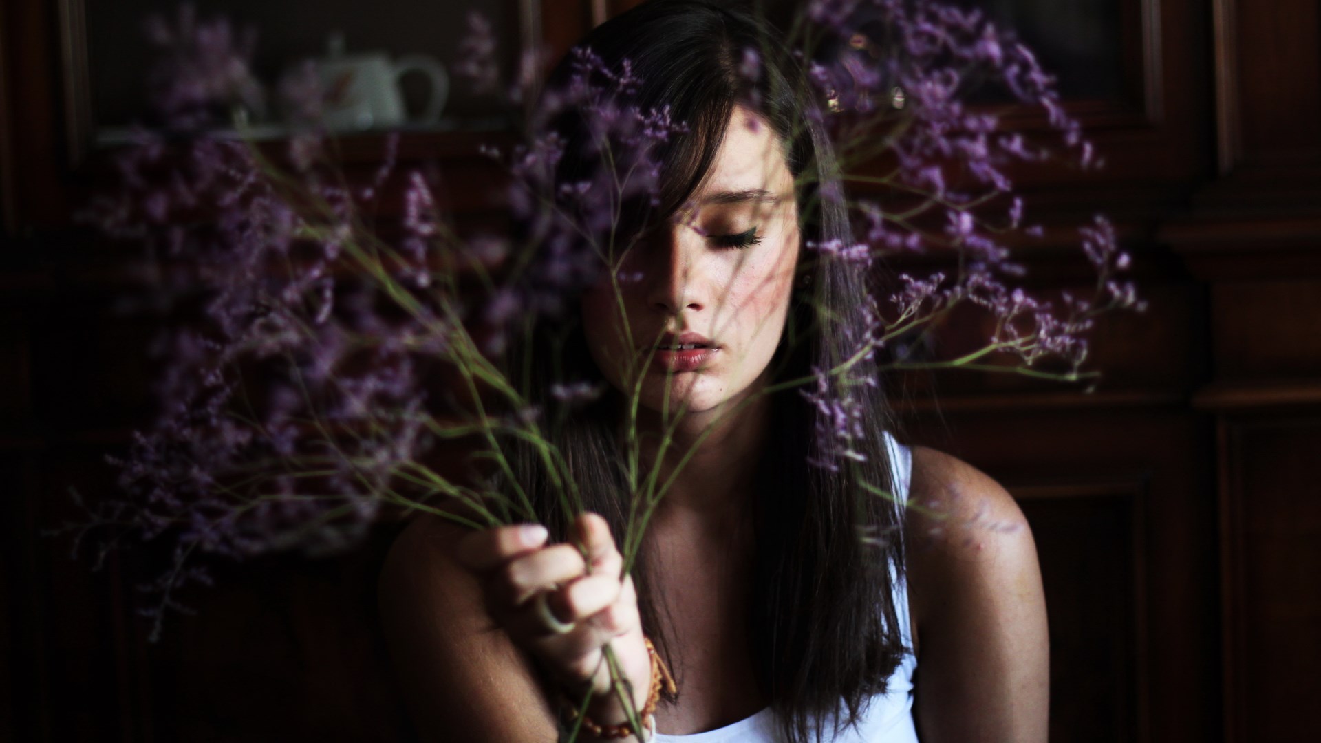 Woman holding purple flowers HD Wallpaper