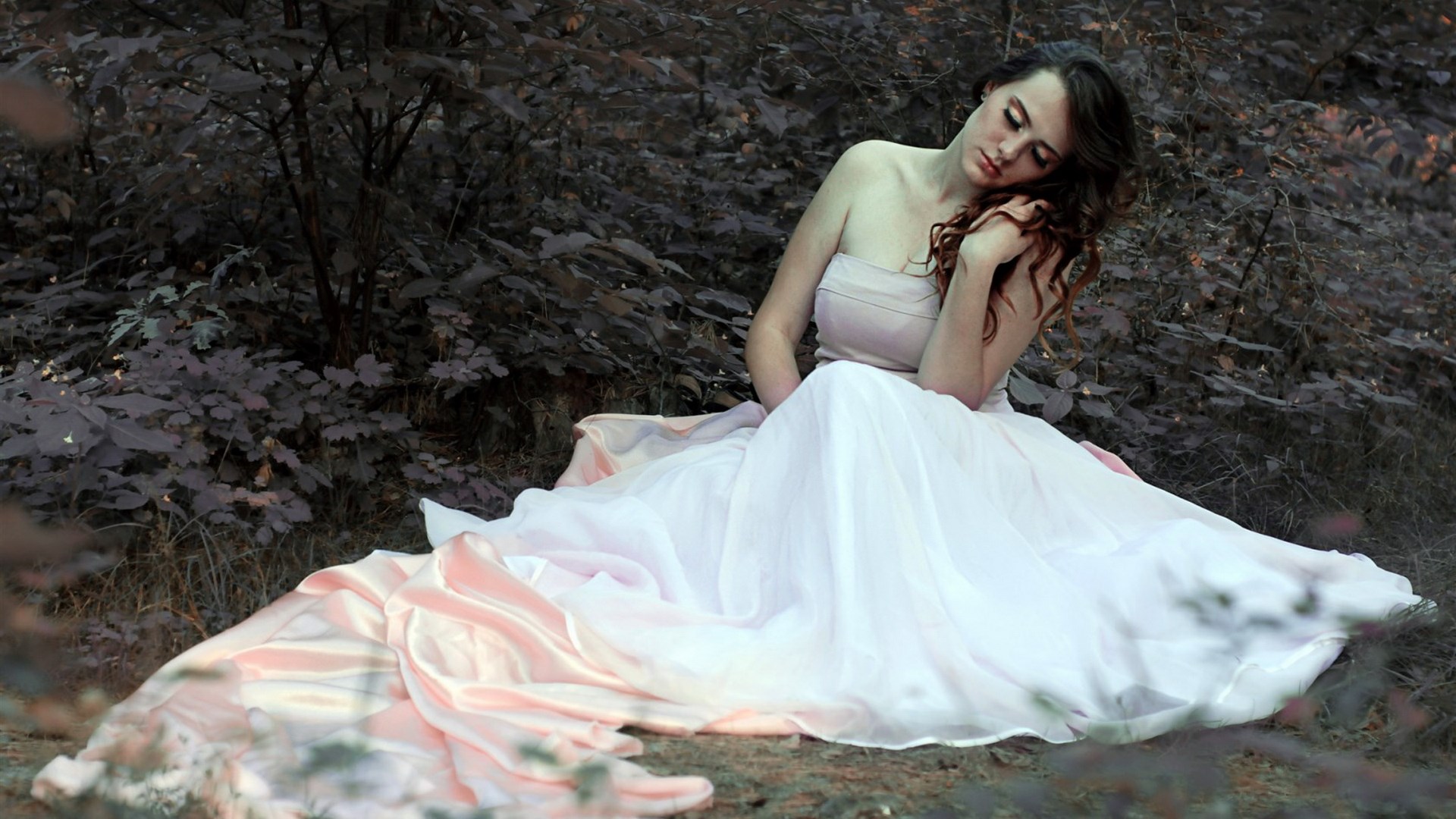 Woman in a flowing dress in a forest HD Wallpaper