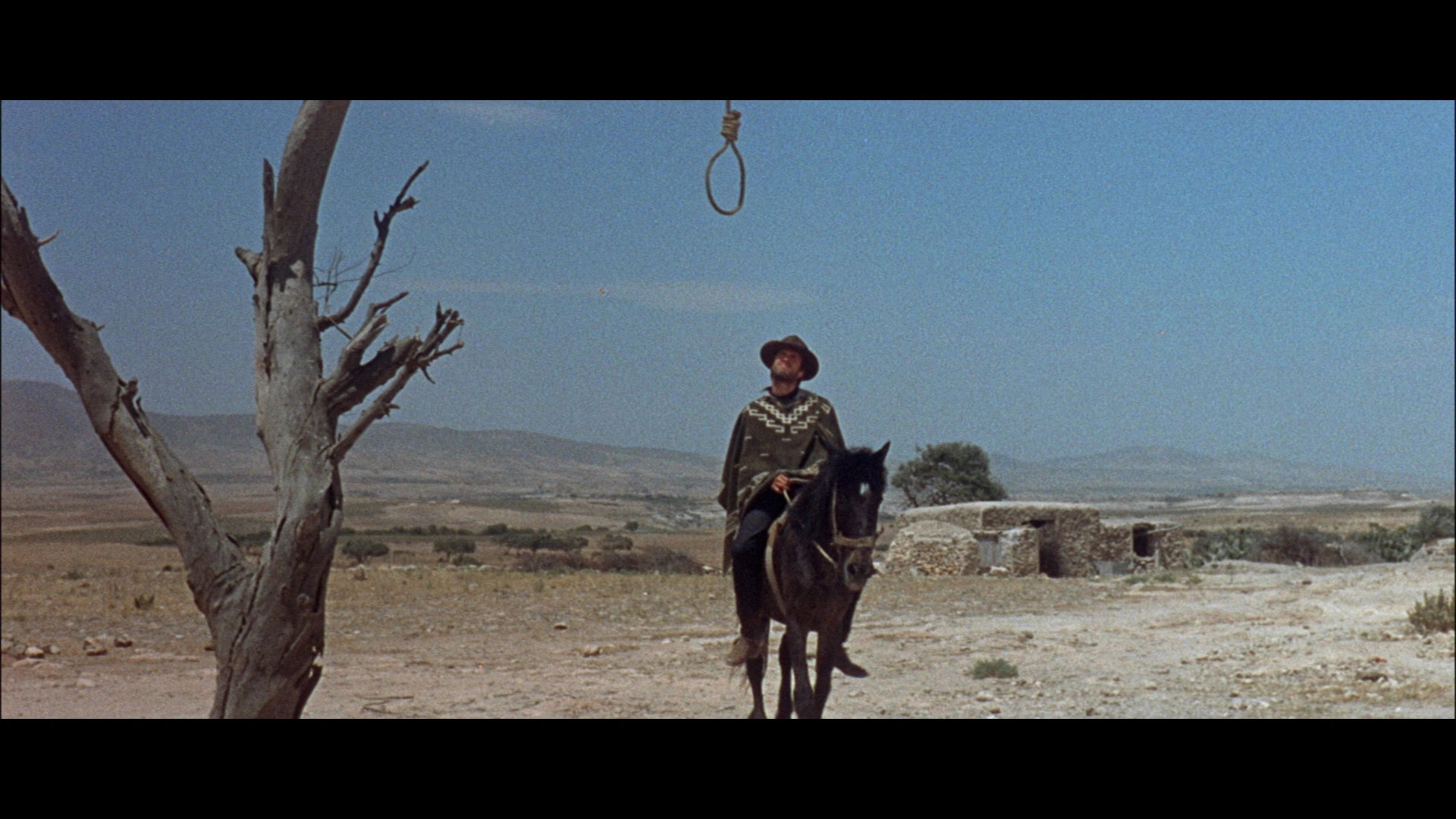 Clint Eastwood on horseback under a noose HD Wallpaper