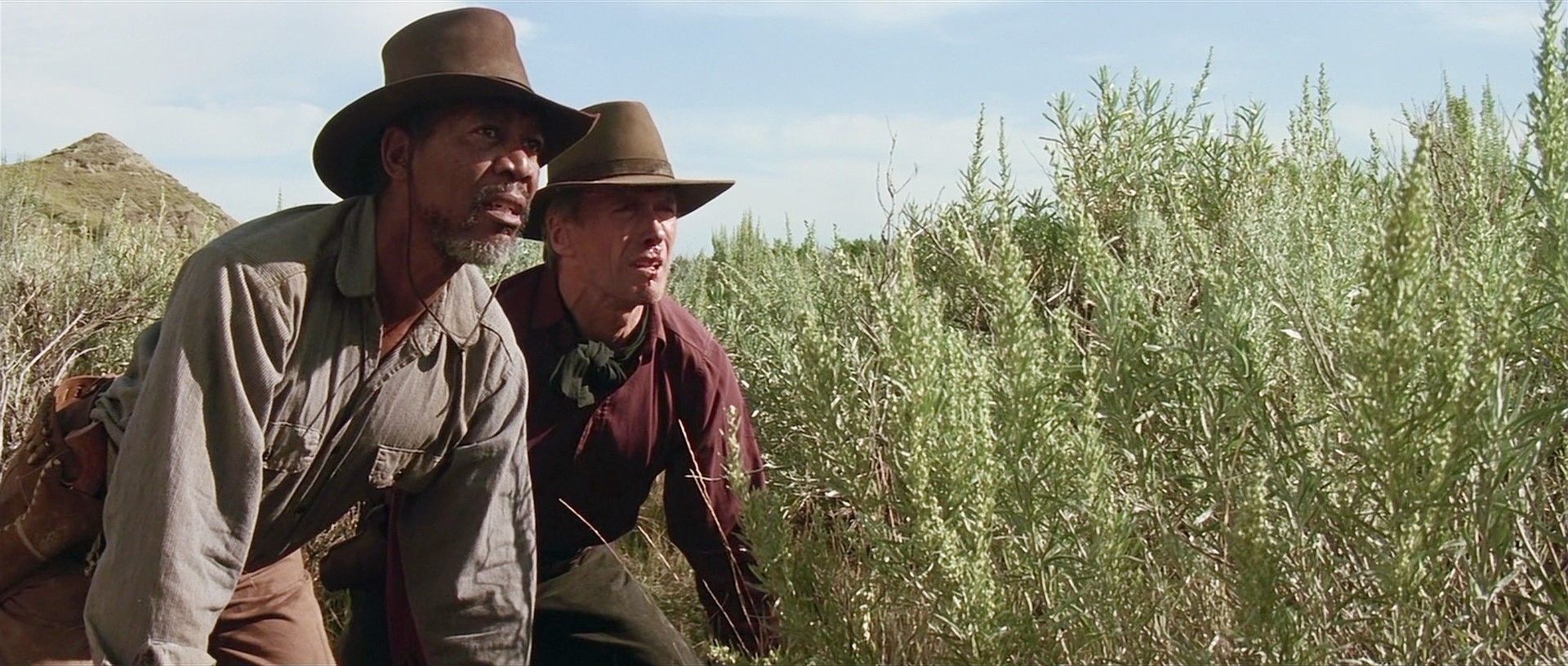 Morgan Freeman and Clint Eastwood in a Western landscape HD Wallpaper