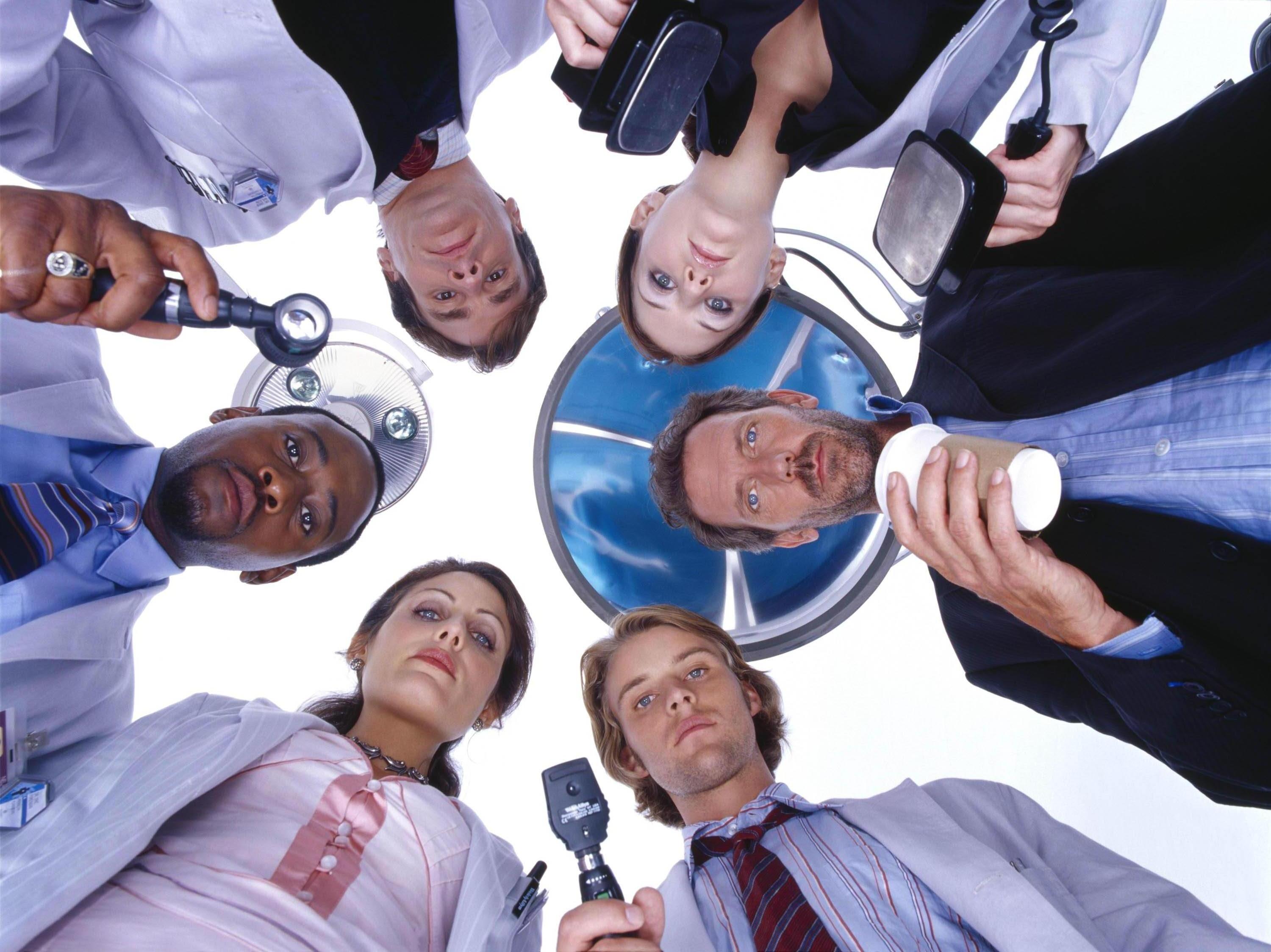 Hugh Laurie and cast of House M.D. looking down HD Wallpaper