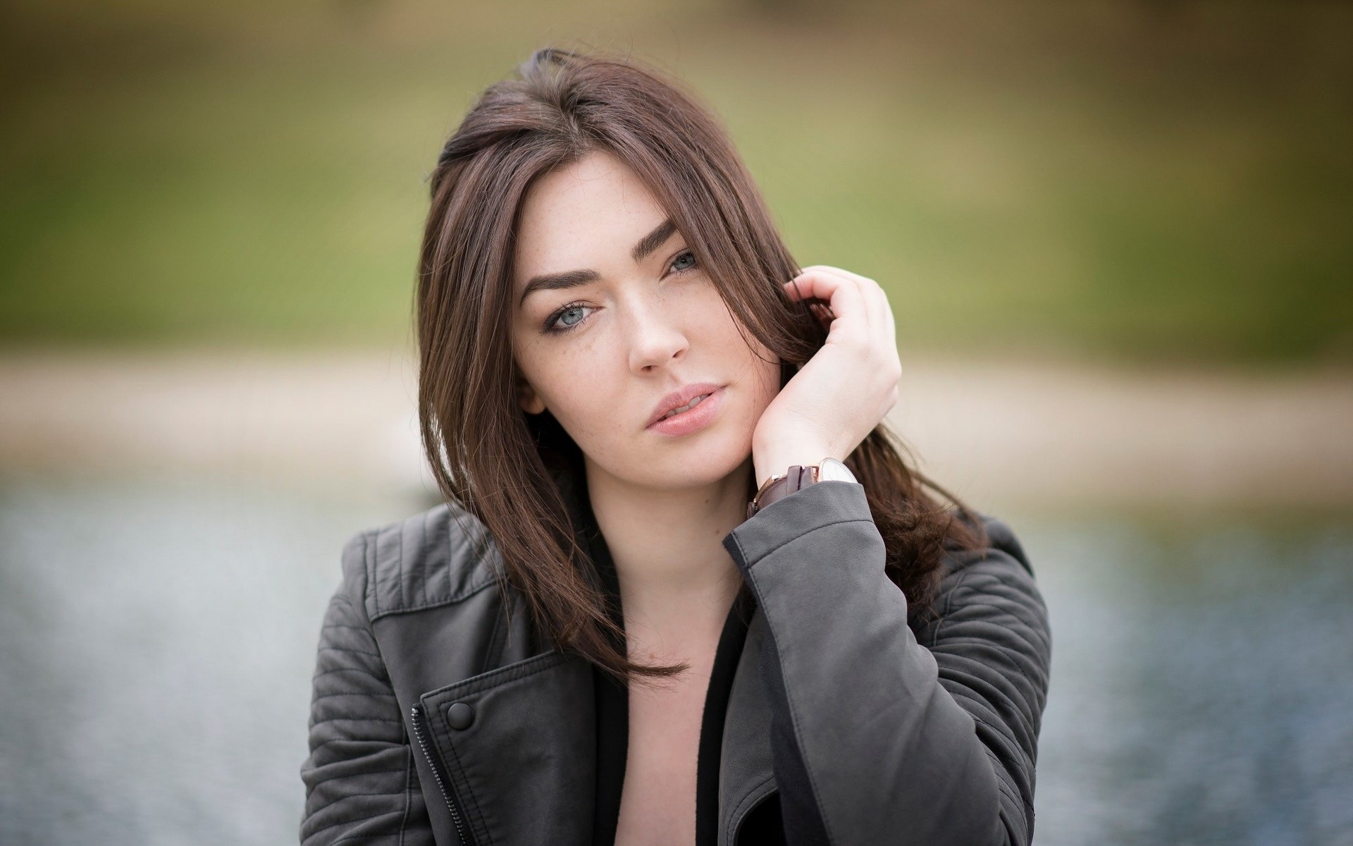 Woman in a black jacket by the water HD Wallpaper
