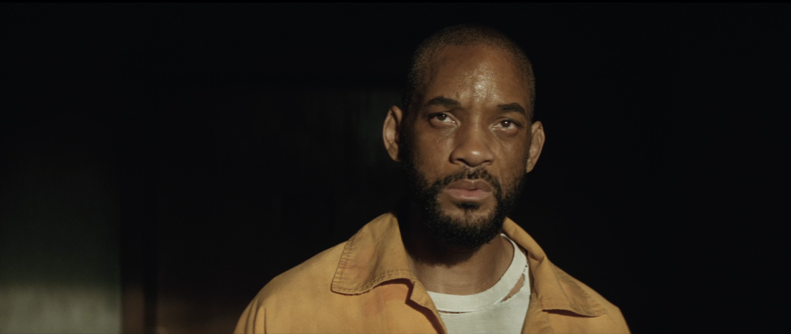 Will Smith in an orange jumpsuit HD Wallpaper