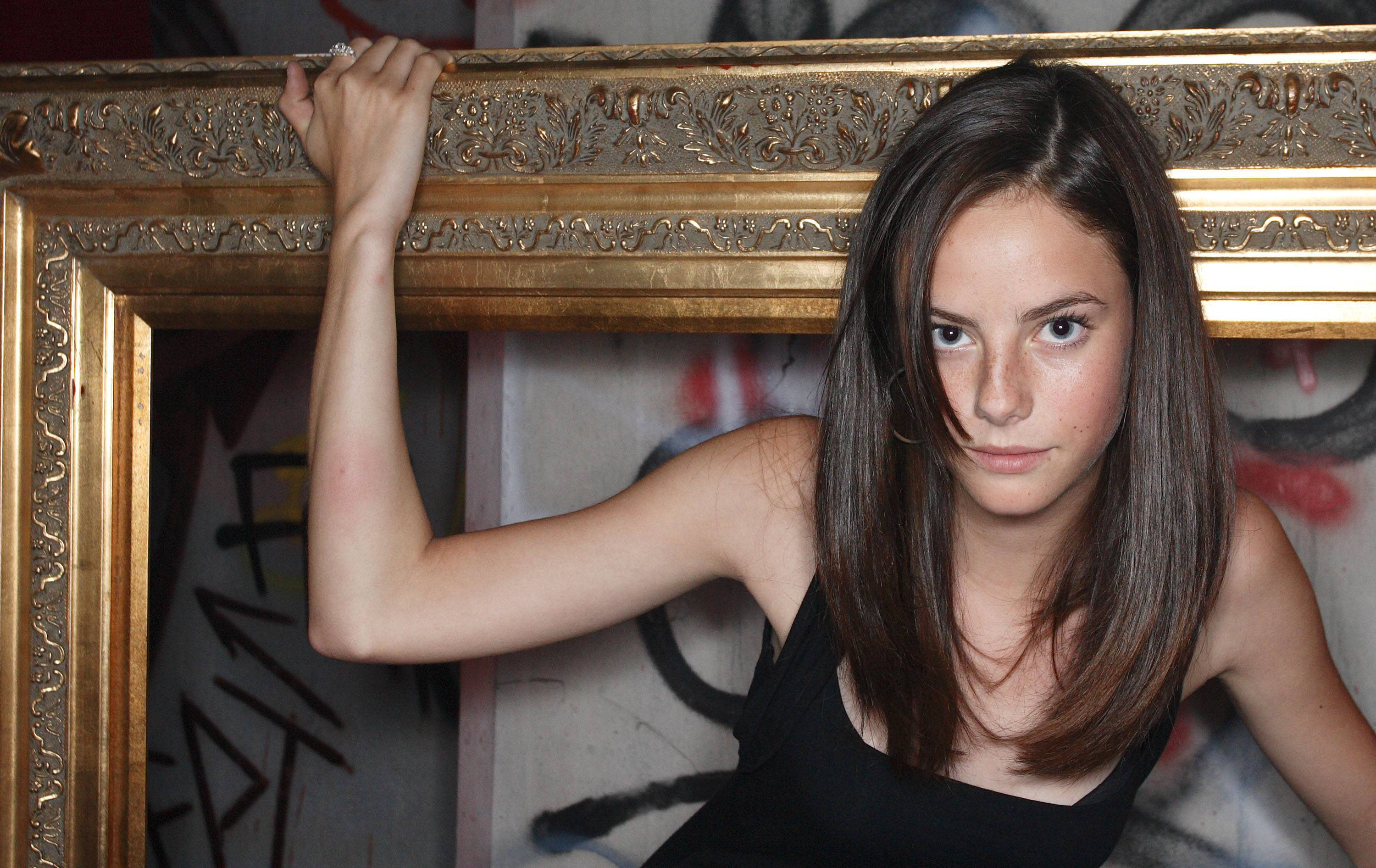 Kaya Scodelario in a golden frame HD Wallpaper