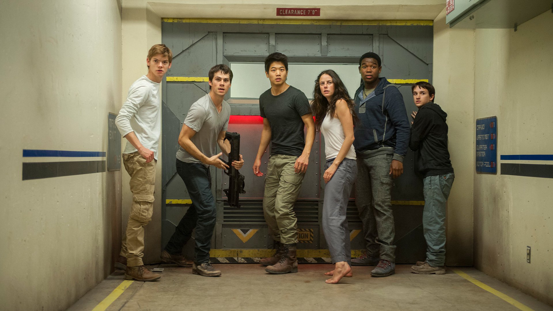 The Maze Runner cast in front of a large door HD Wallpaper