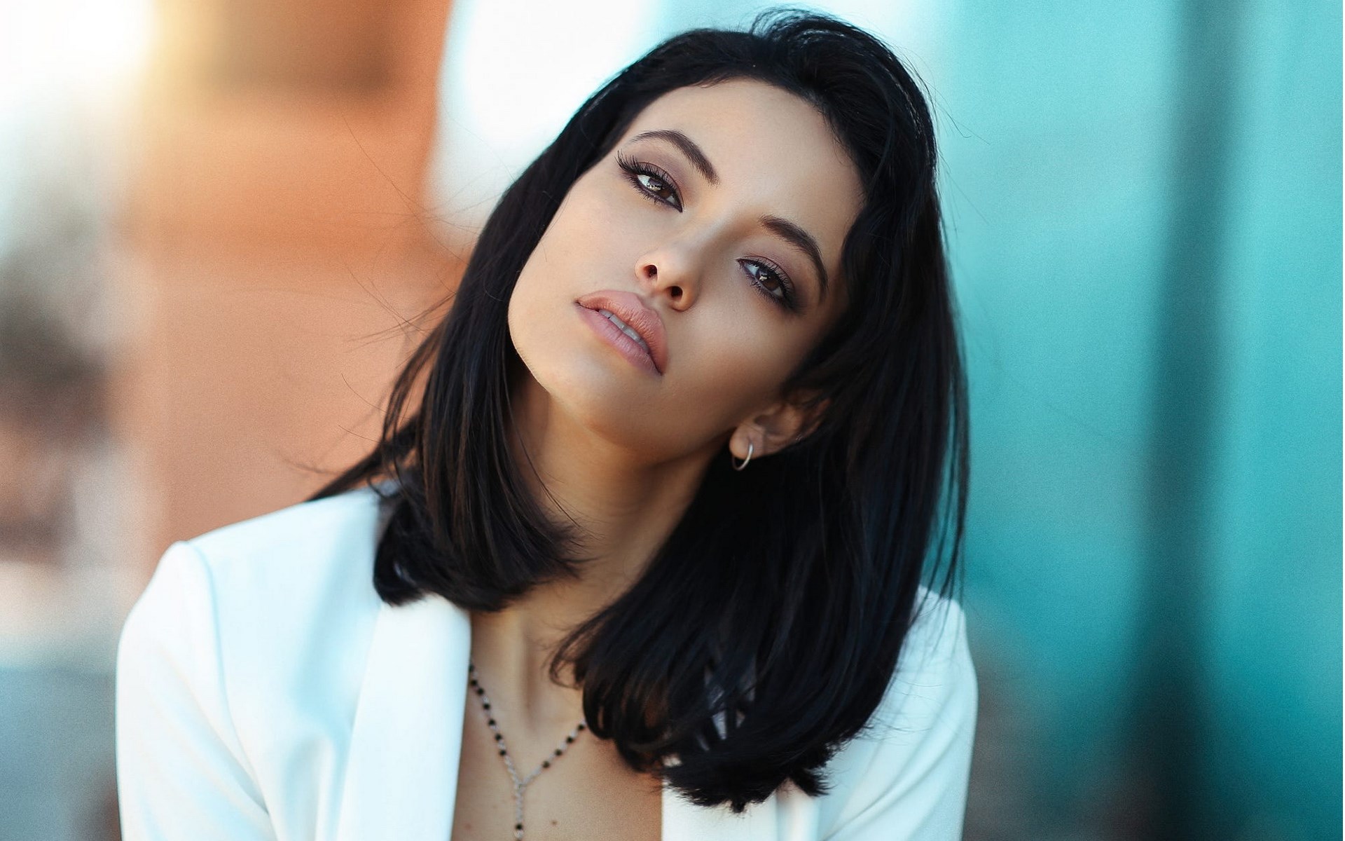 Woman in white blazer with dark hair HD Wallpaper