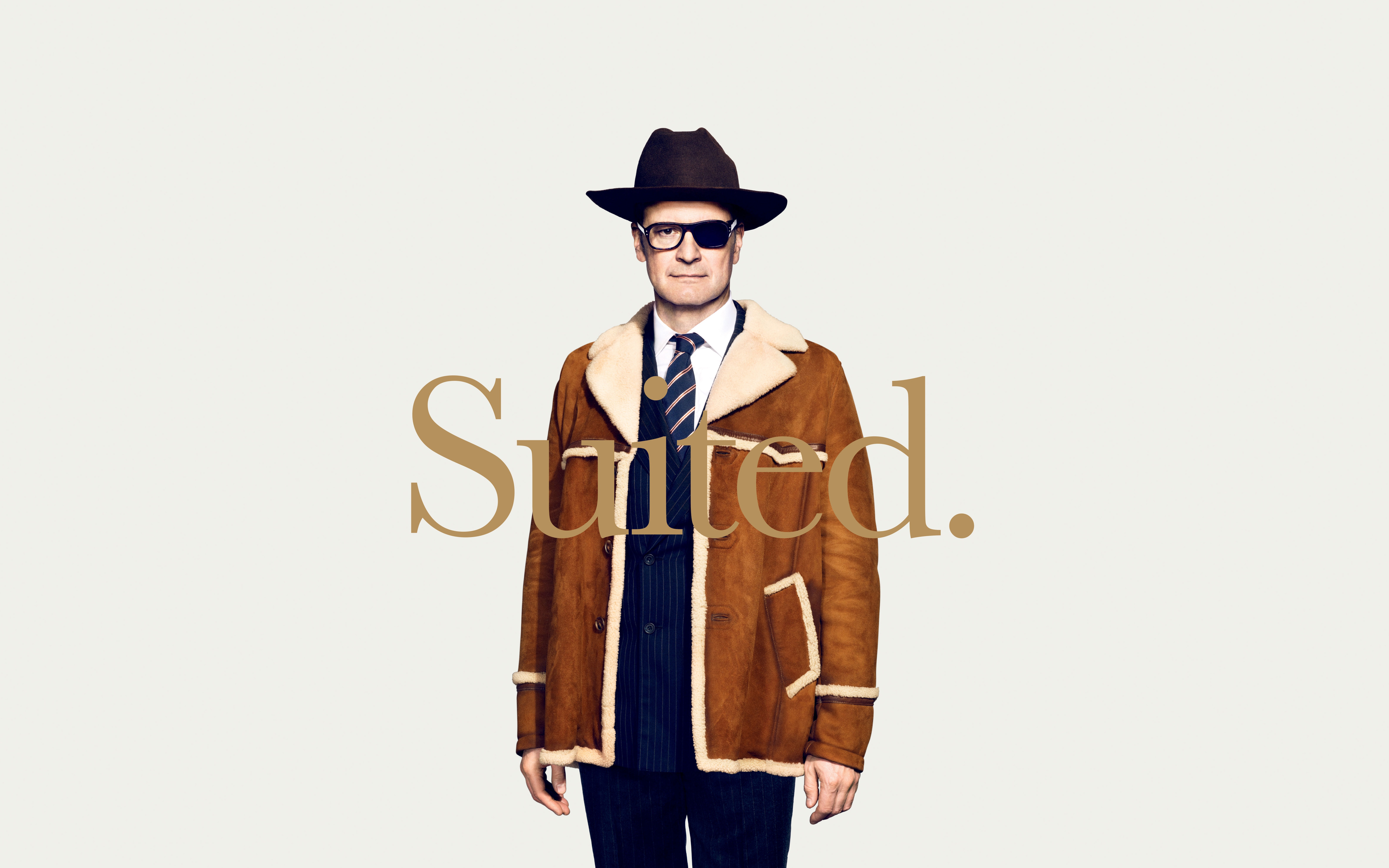 Colin Firth in a brown shearling coat and hat HD Wallpaper