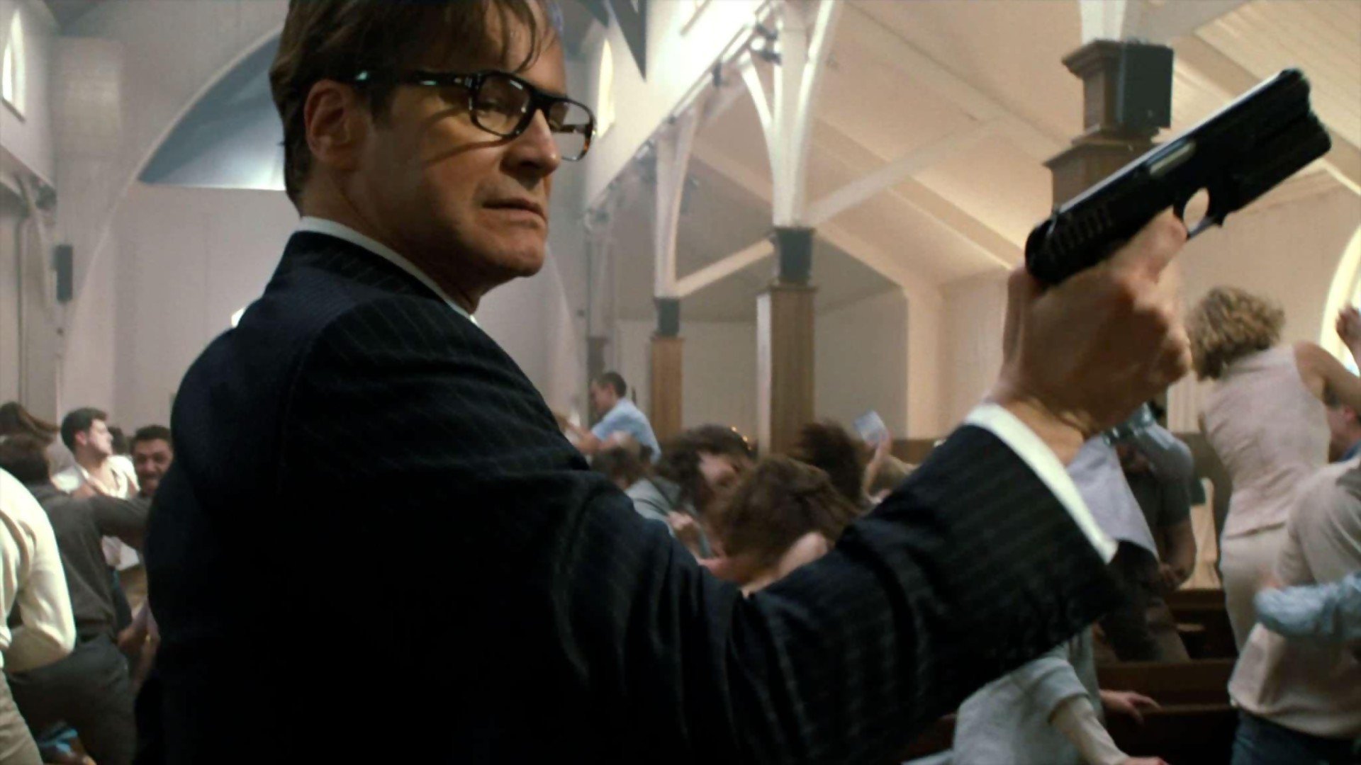 Colin Firth holding a gun in a church HD Wallpaper