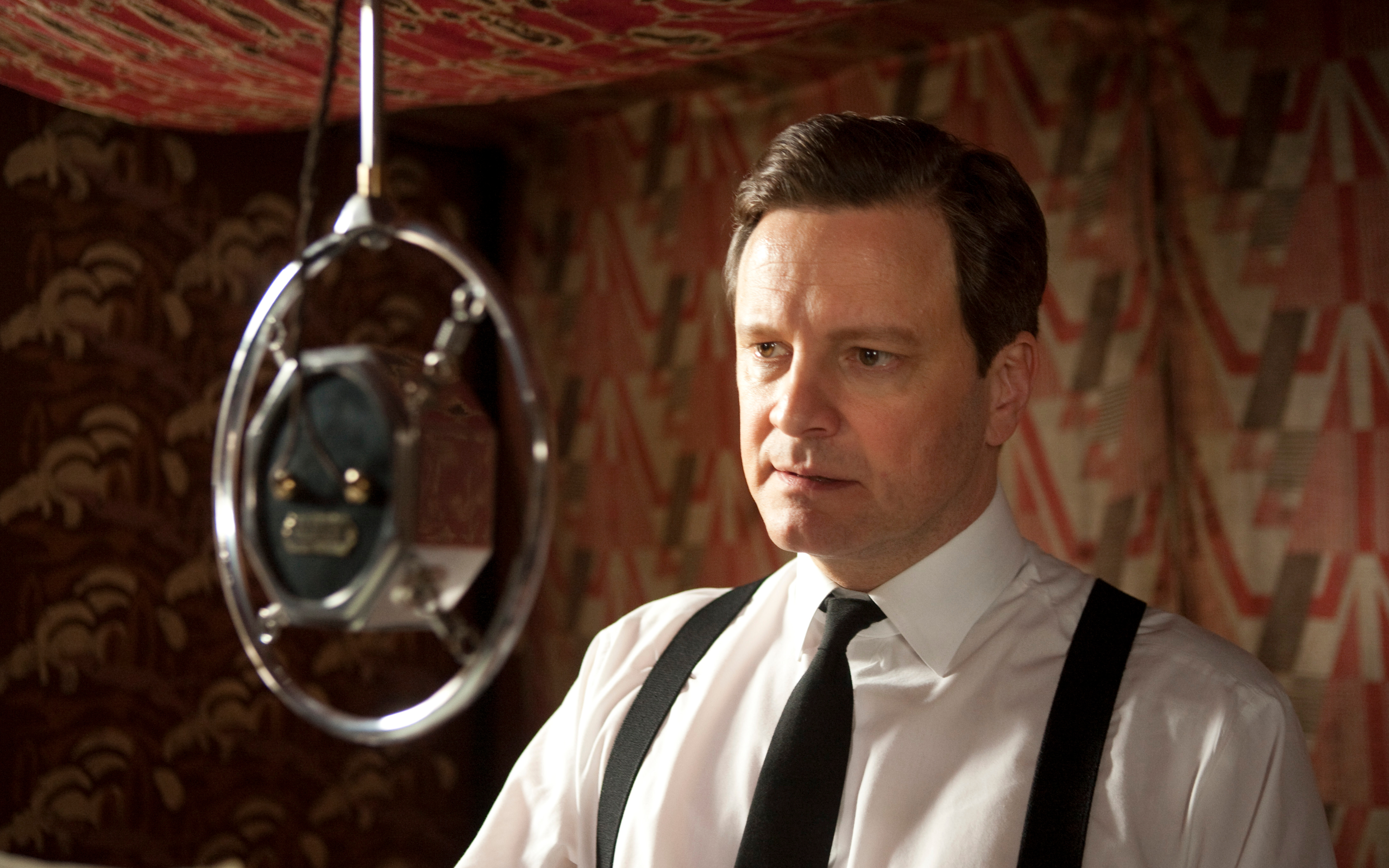Colin Firth in front of a microphone HD Wallpaper
