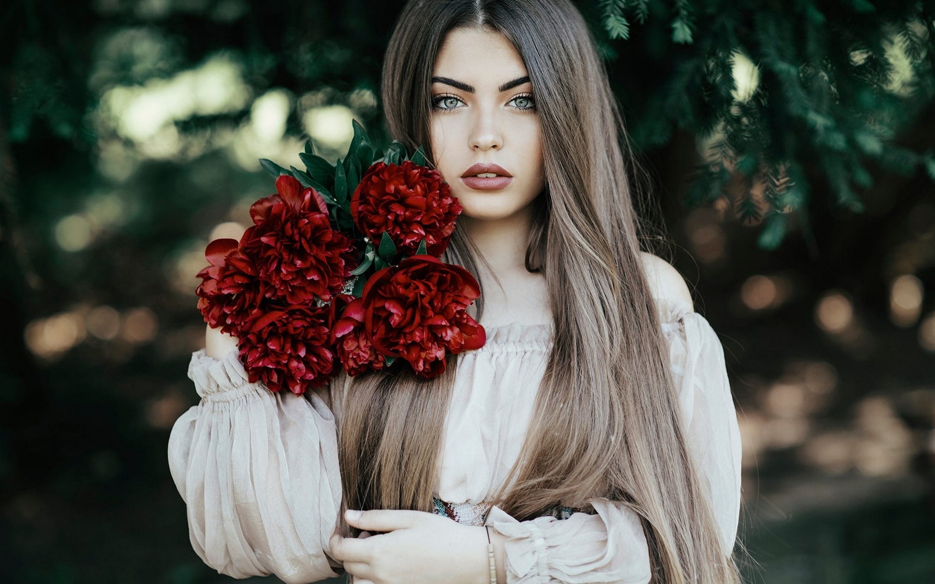 Woman holding red peonies HD Wallpaper