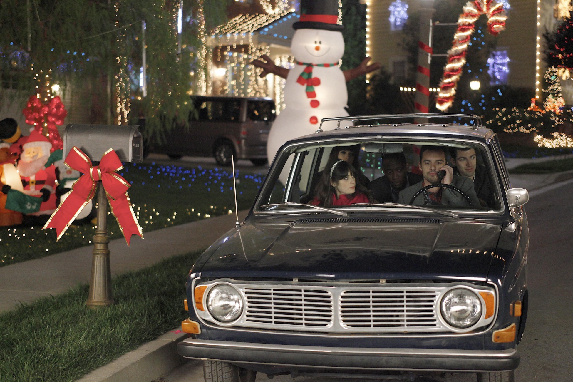 Max Greenfield and friends in a car during Christmas HD Wallpaper