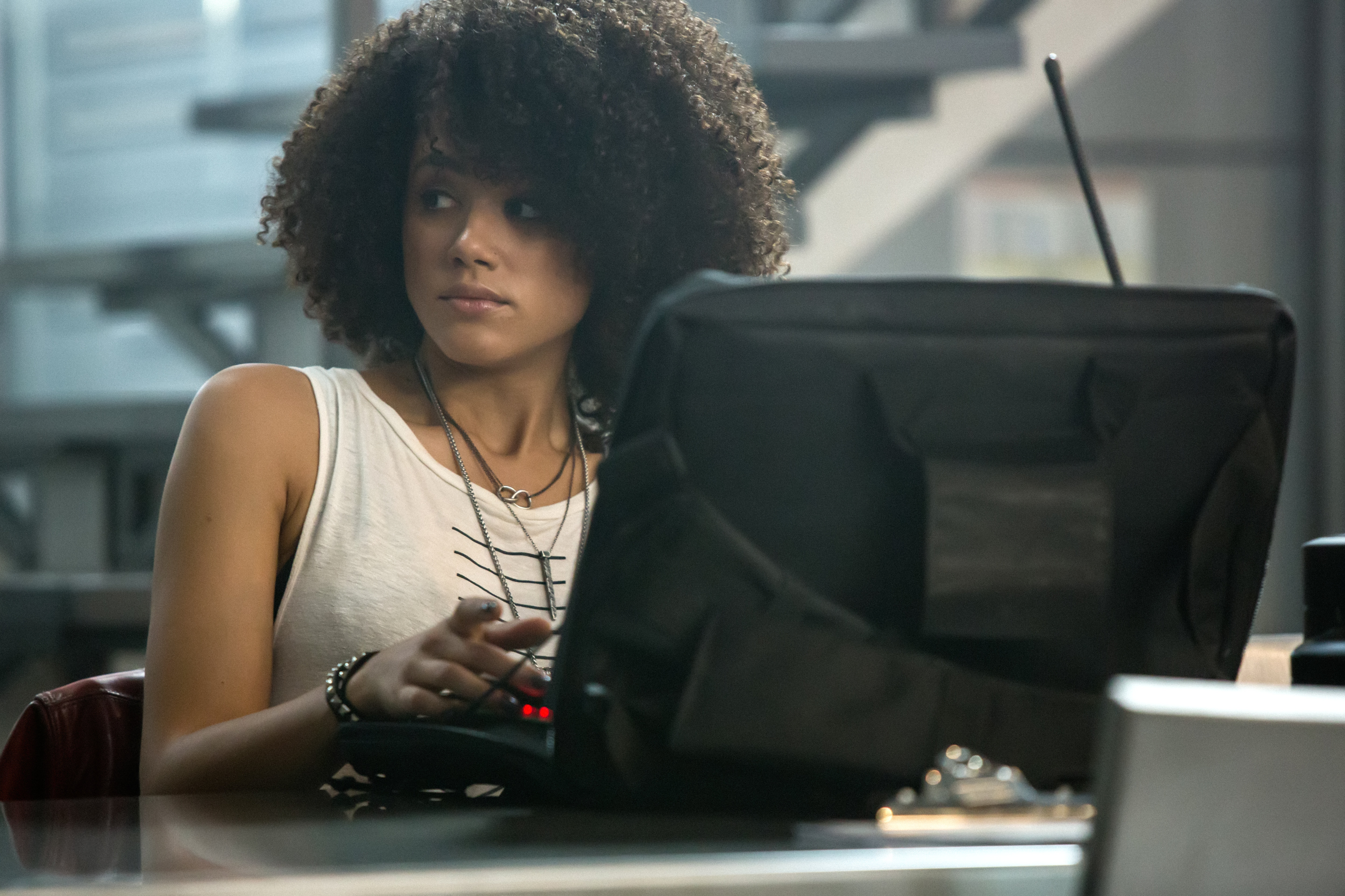 Nathalie Emmanuel working on a computer HD Wallpaper