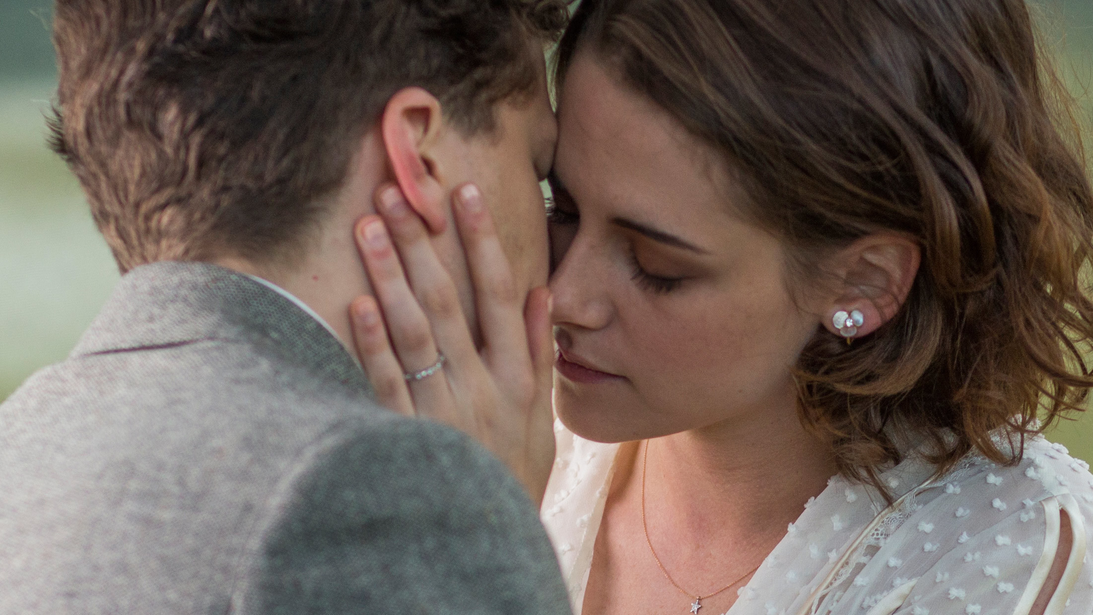Jesse Eisenberg and woman in intimate moment HD Wallpaper