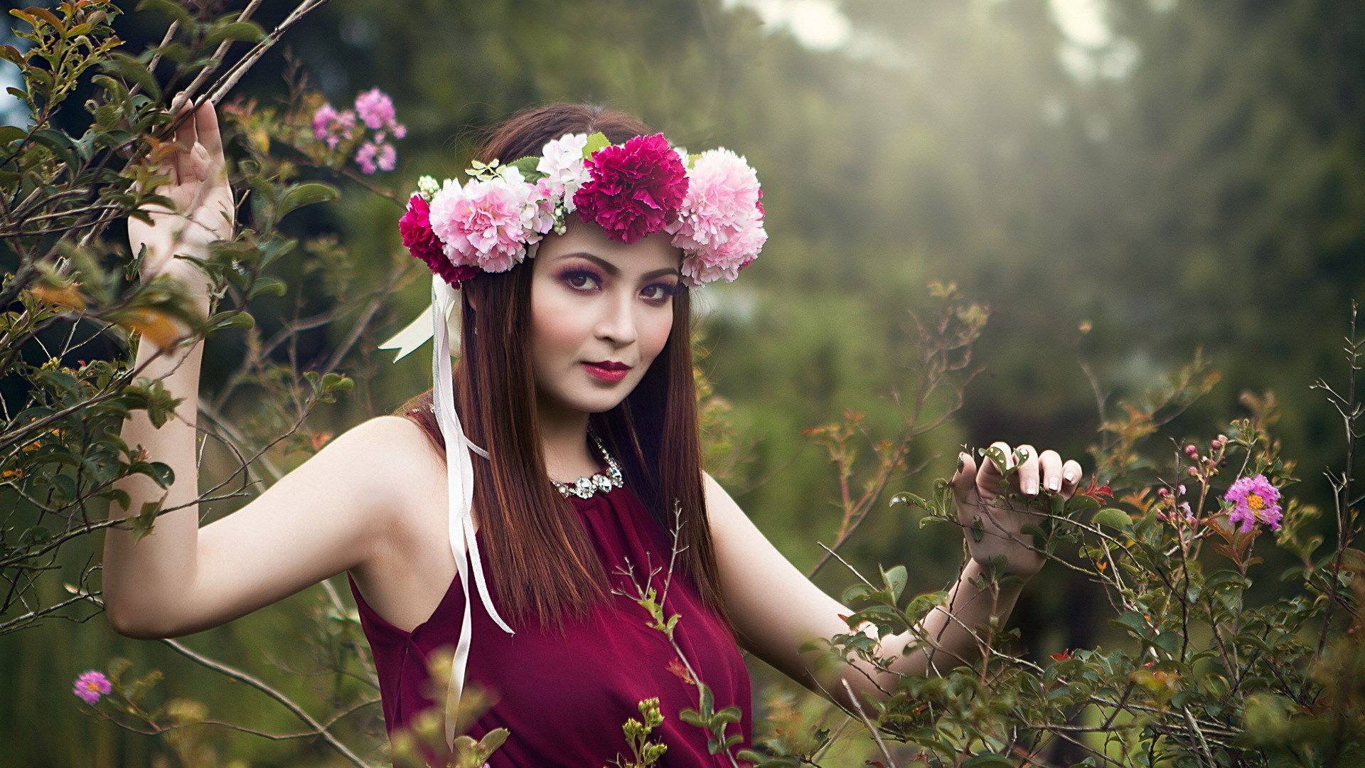 Woman with flower crown in a garden HD Wallpaper