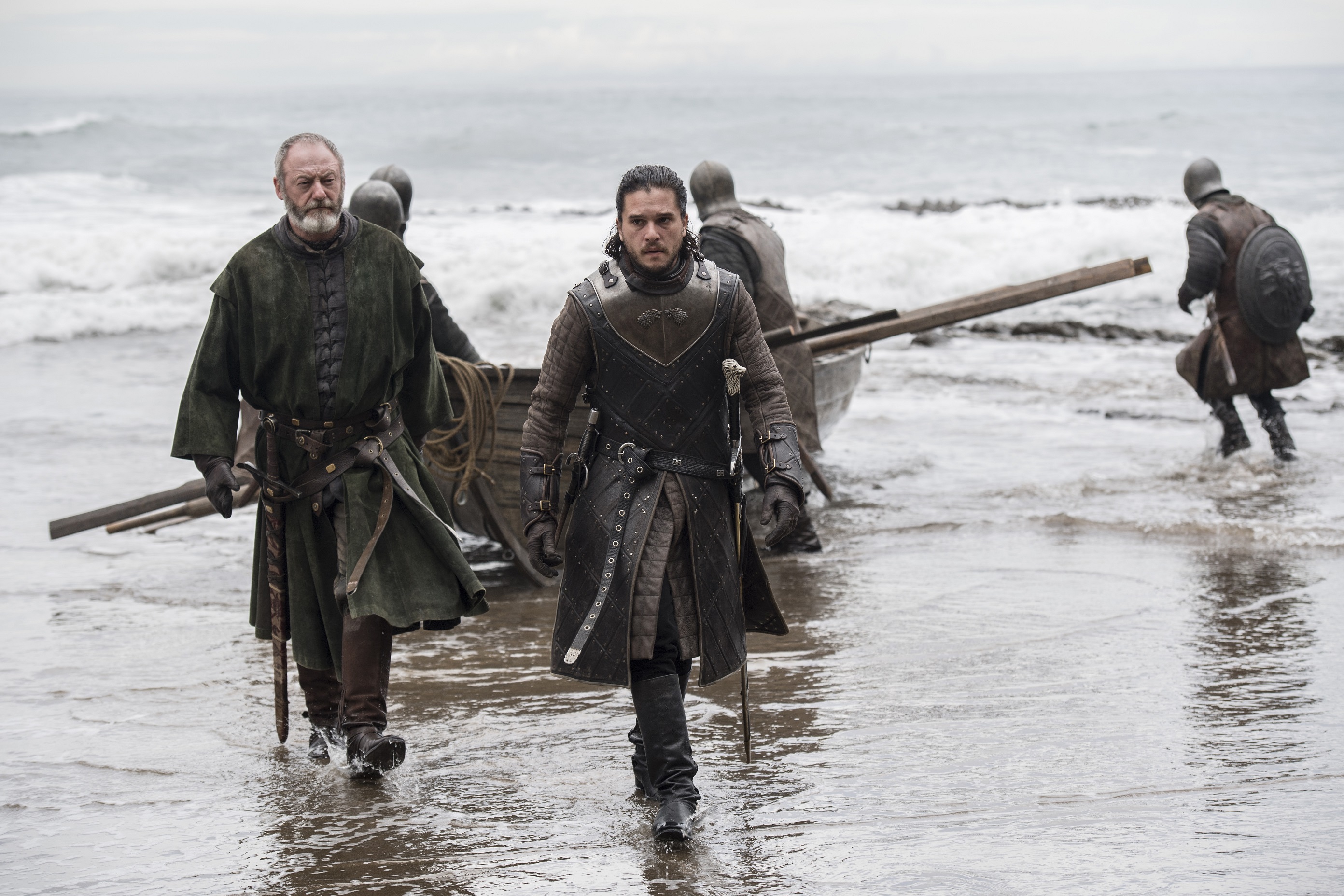 Liam Cunningham and Jon Snow on a beach HD Wallpaper
