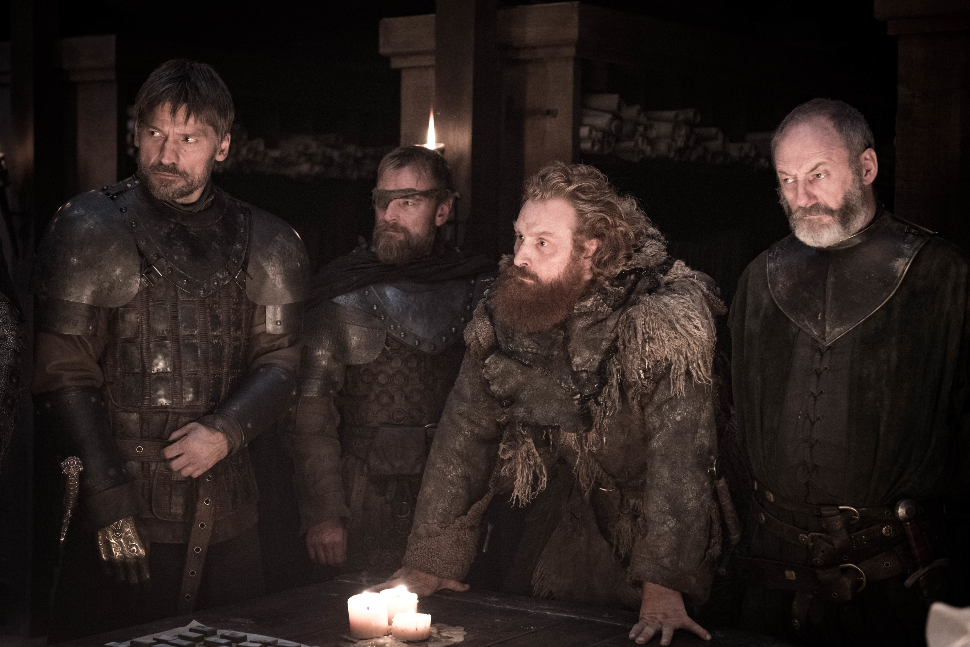 Four men in armor and furs gathered around a table HD Wallpaper