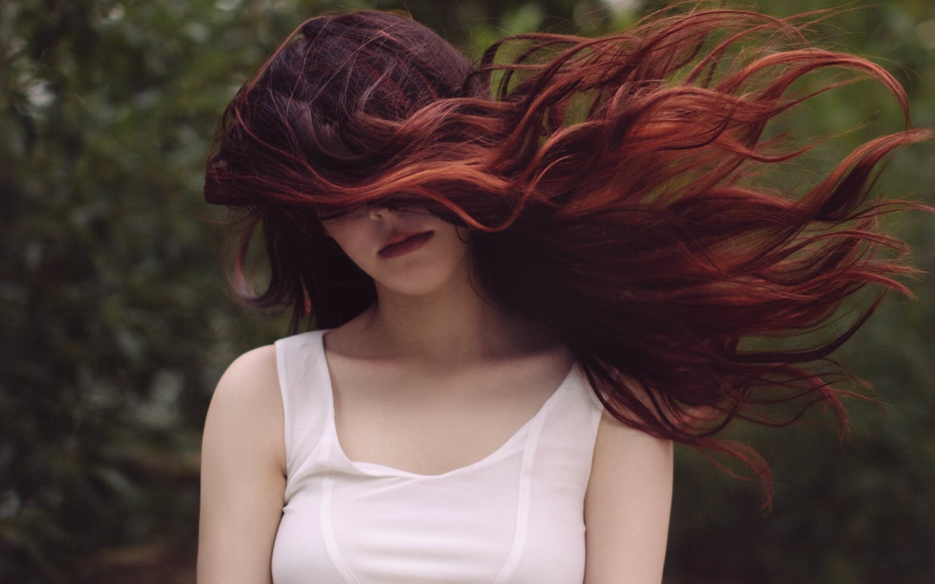 Woman with windblown auburn hair HD Wallpaper