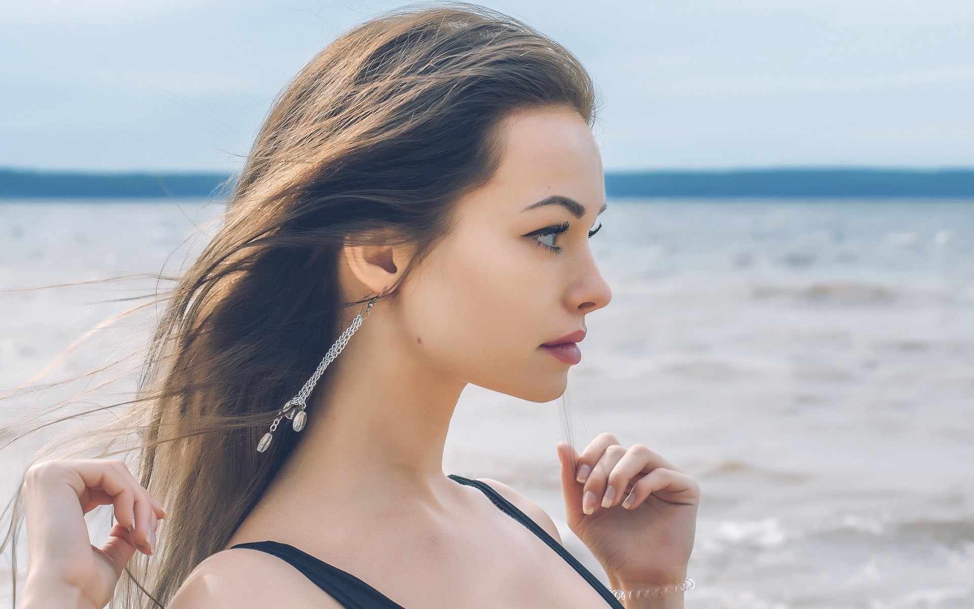 Woman with long hair by the water HD Wallpaper