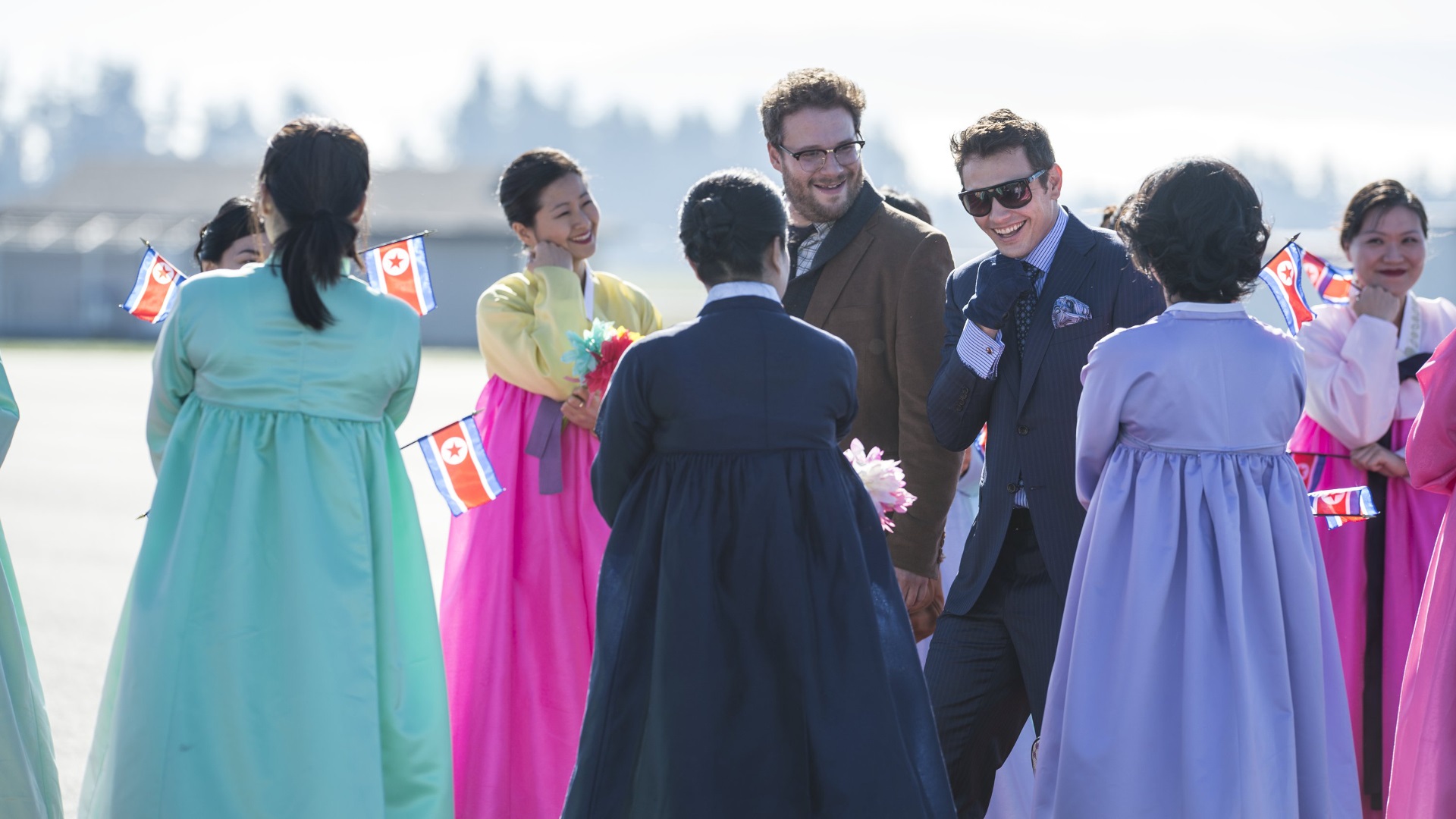James Franco and Seth Rogen with North Korean women HD Wallpaper