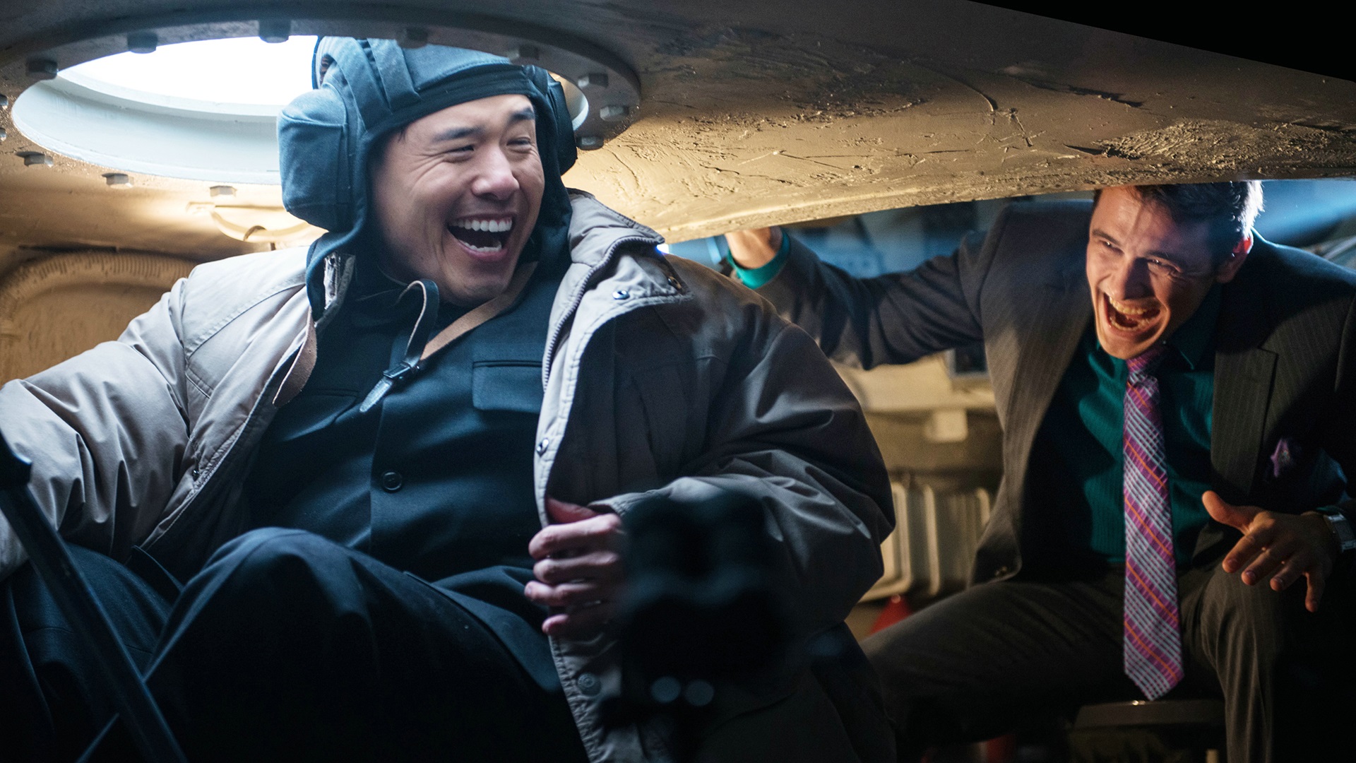 James Franco and Randall Park in a tank HD Wallpaper