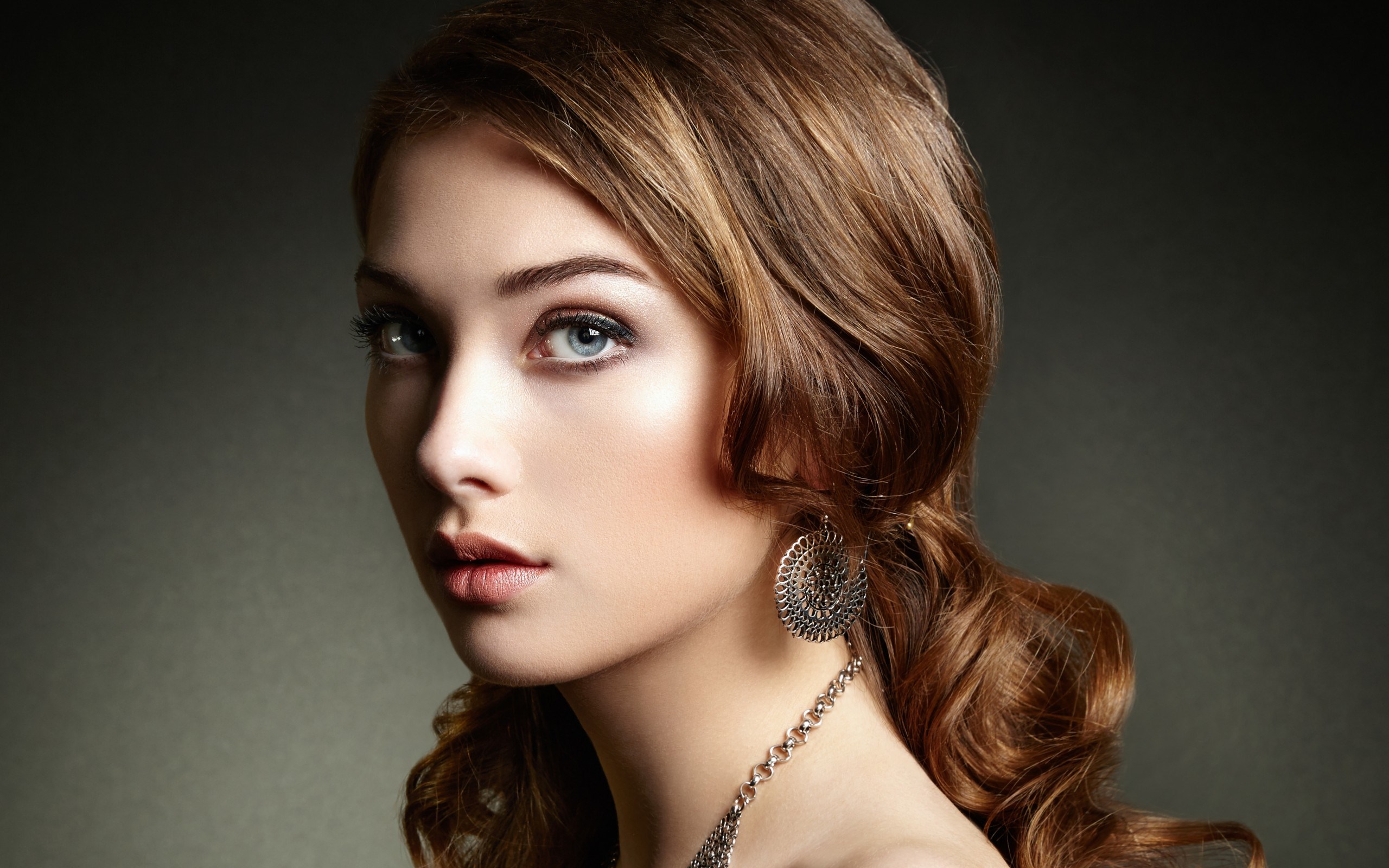 Woman with brown hair and earrings HD Wallpaper