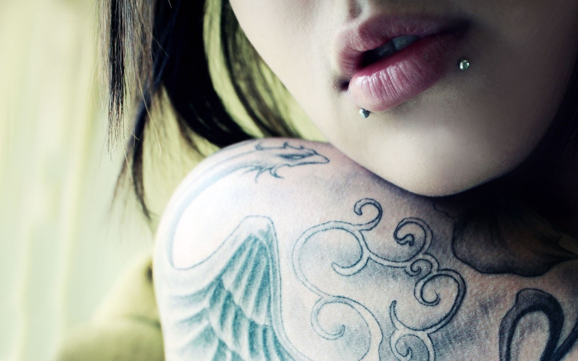 Woman with lip and shoulder tattoos HD Wallpaper