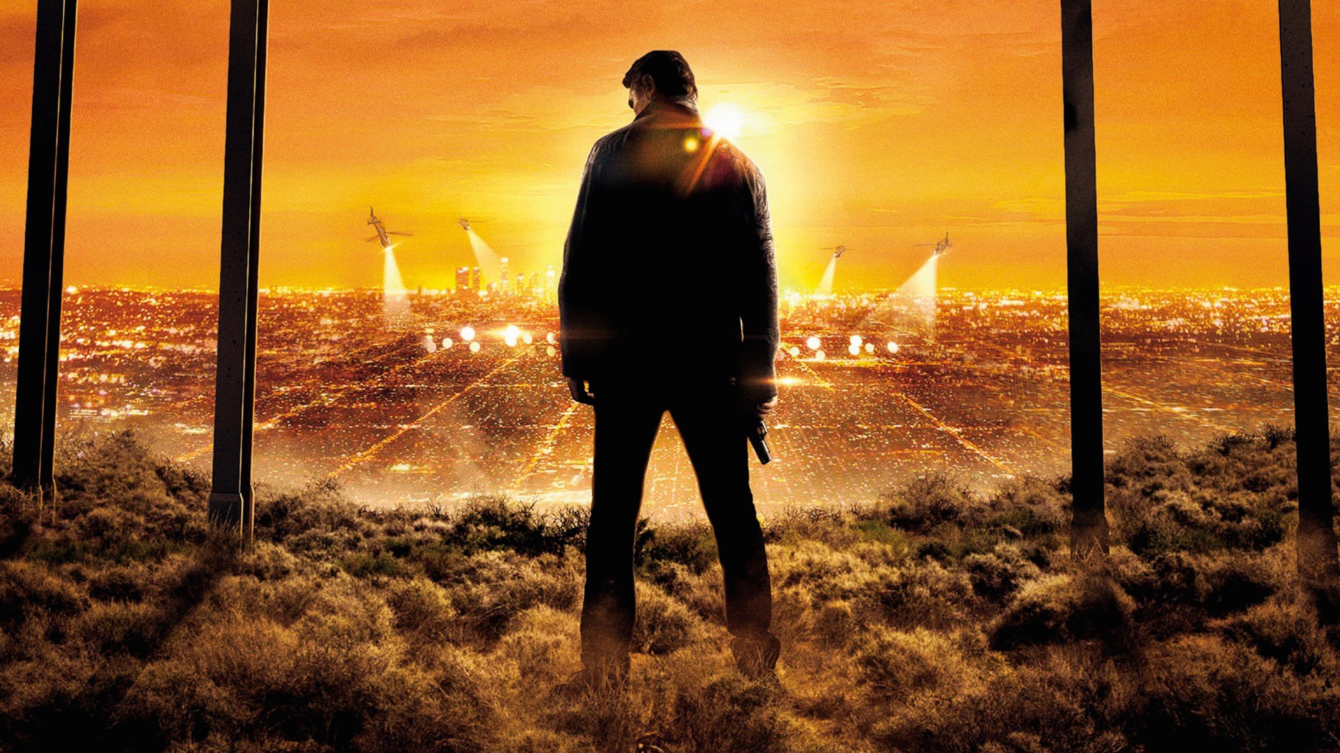 Liam Neeson in a city at sunset HD Wallpaper