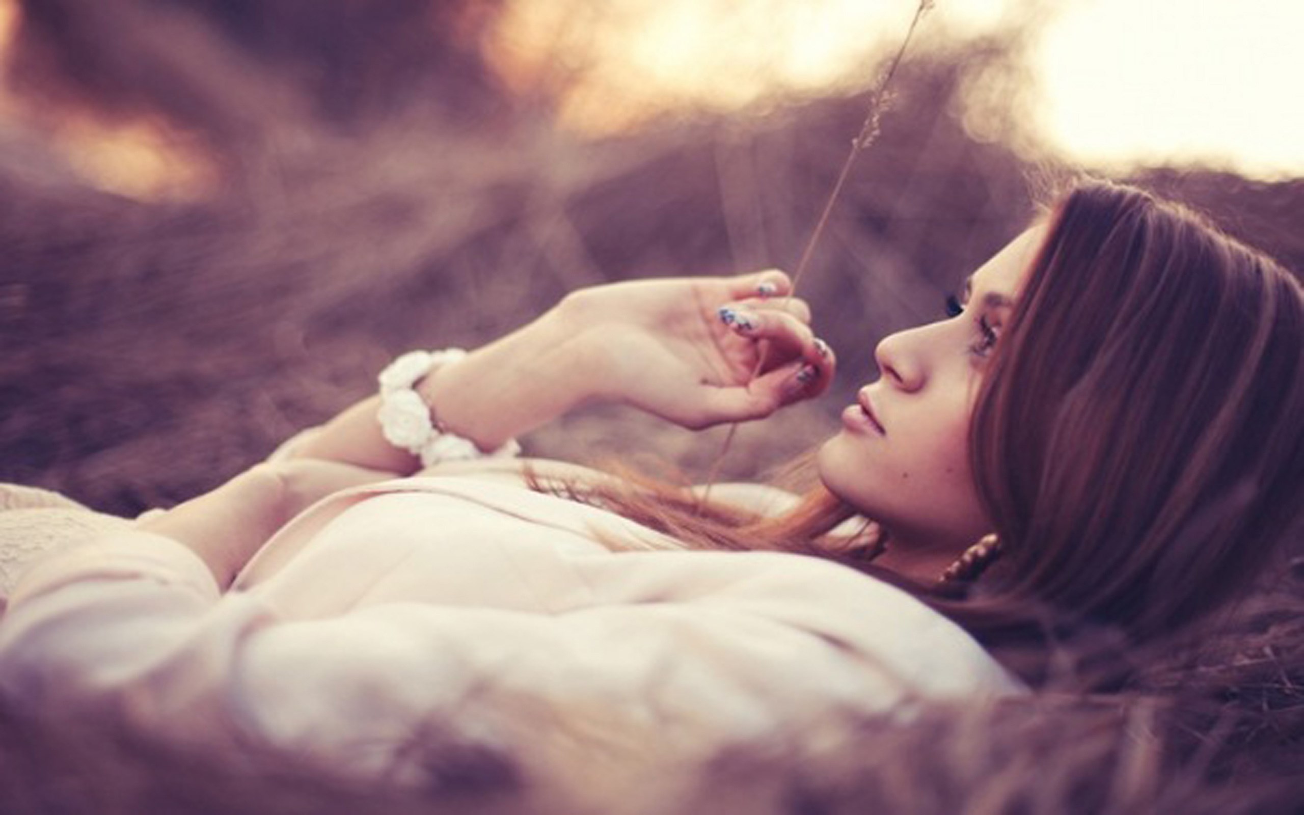 Woman lying in dry grass HD Wallpaper