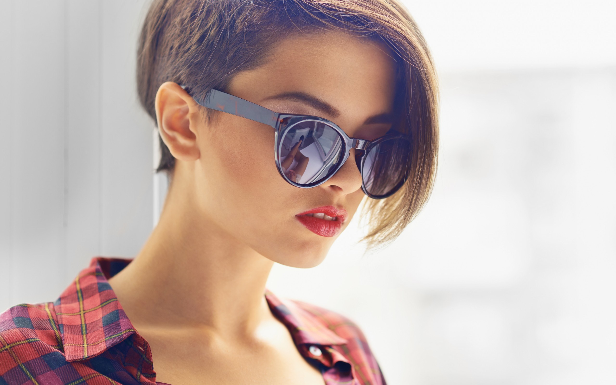 Woman with short hair and sunglasses wearing a plaid shirt HD Wallpaper