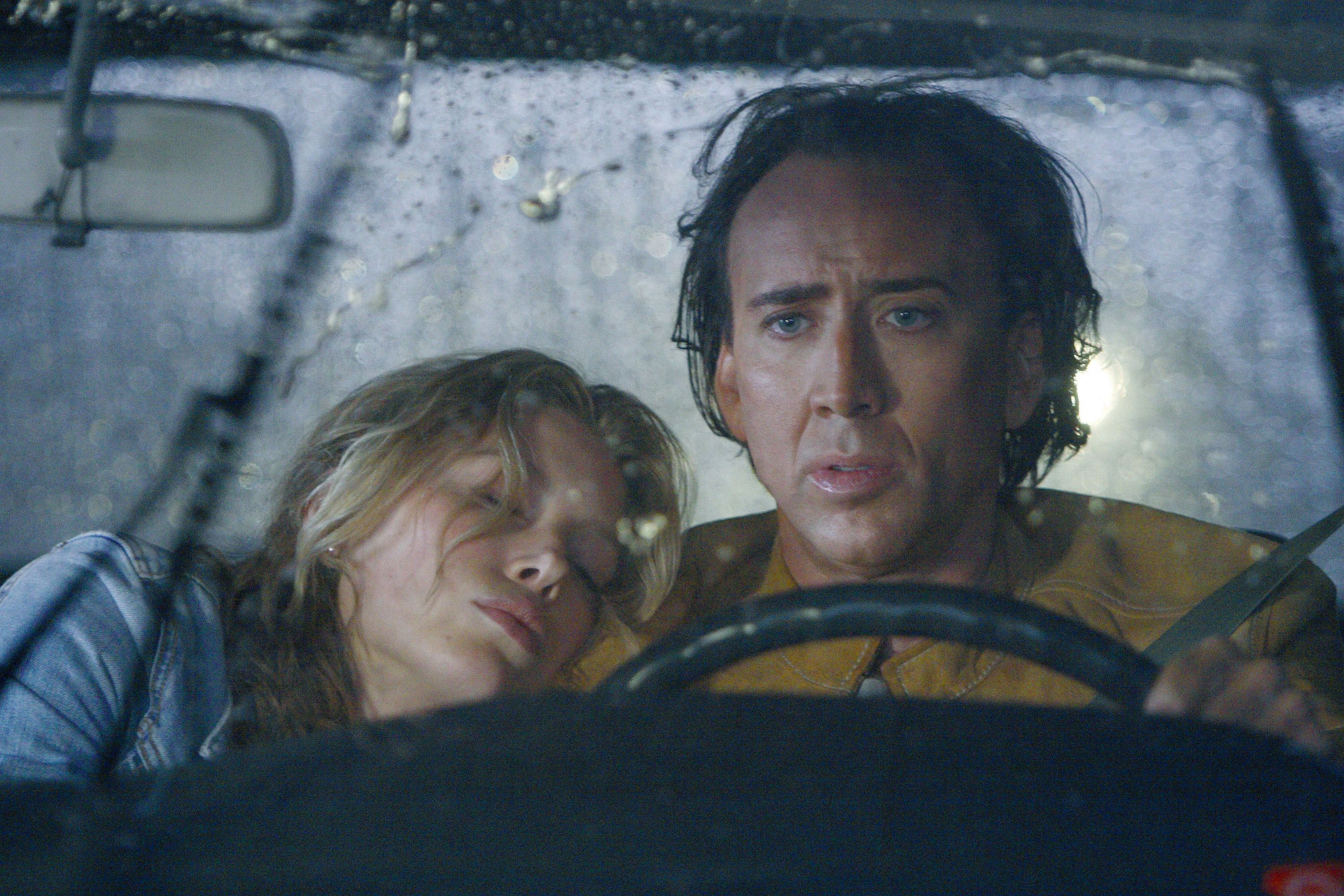 Nicolas Cage and Woman in Car HD Wallpaper