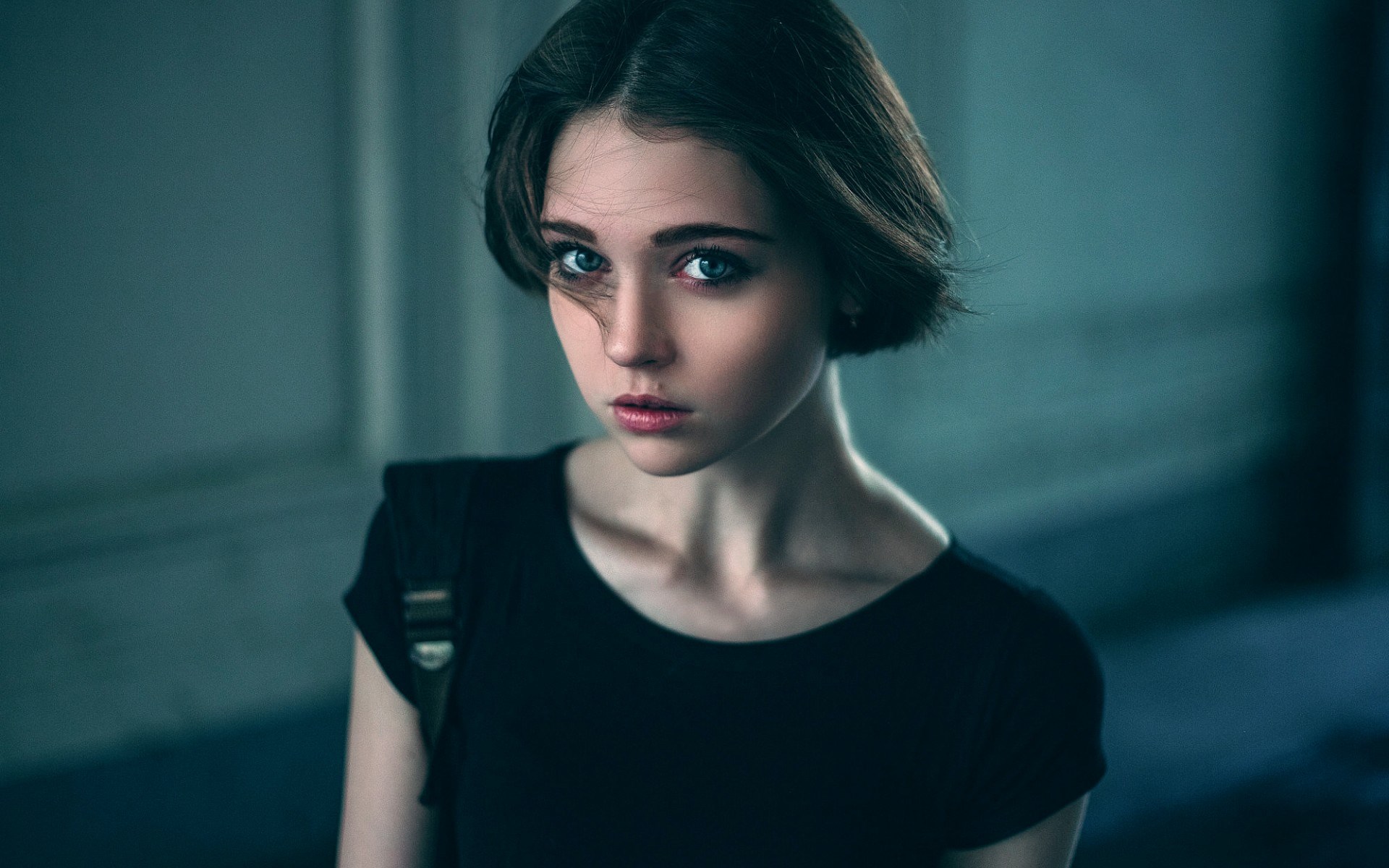 Young woman with short dark hair and blue eyes HD Wallpaper