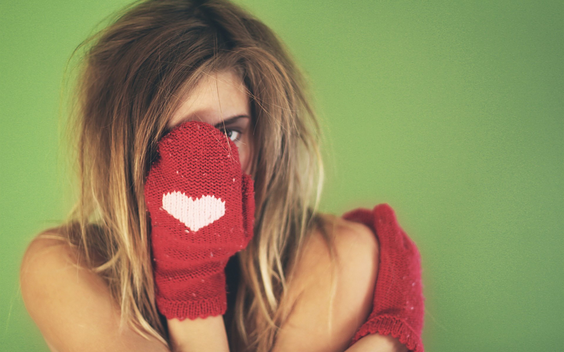 Woman wearing red mittens with heart HD Wallpaper
