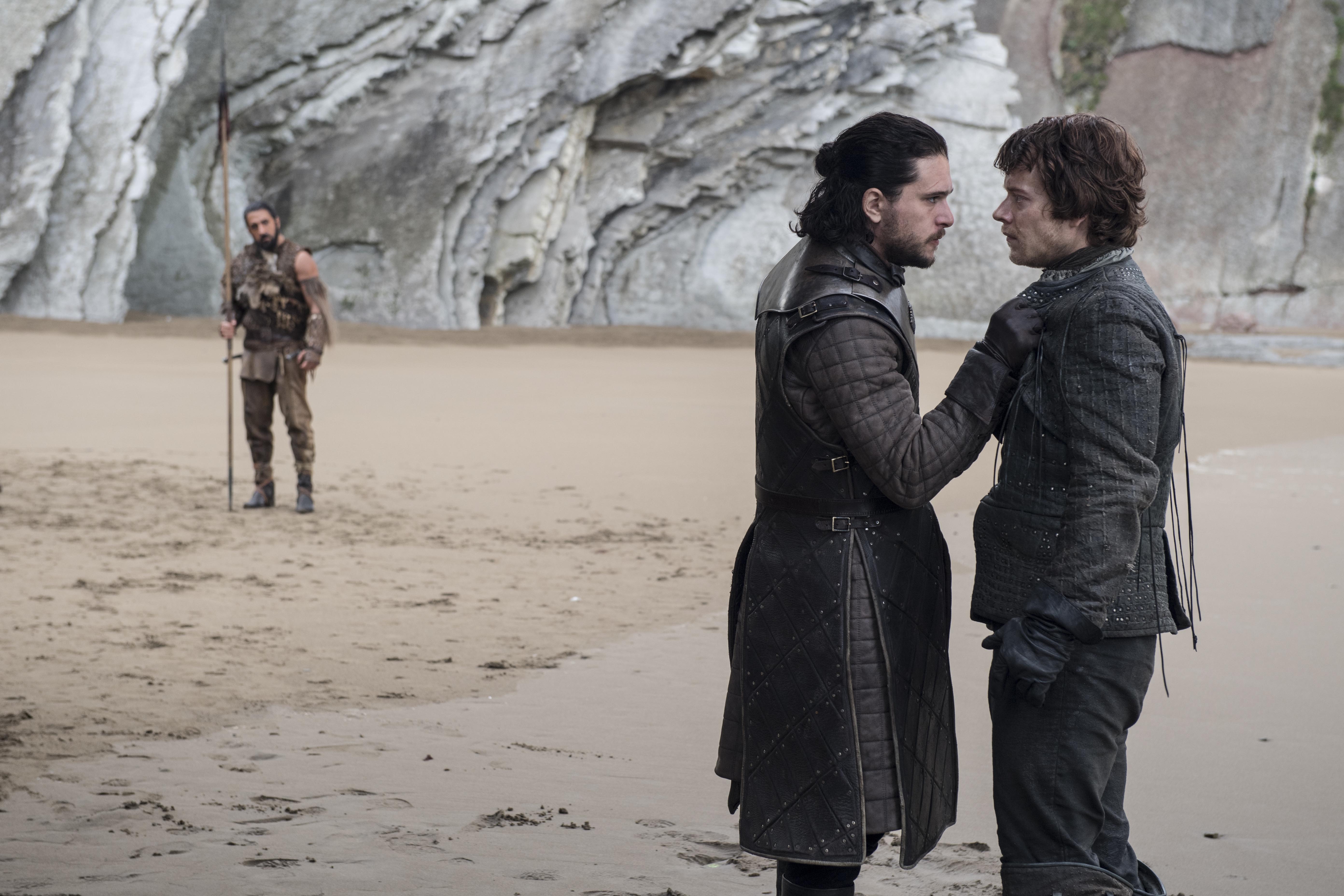 Theon and Jon Snow on a beach with a man in the background HD Wallpaper