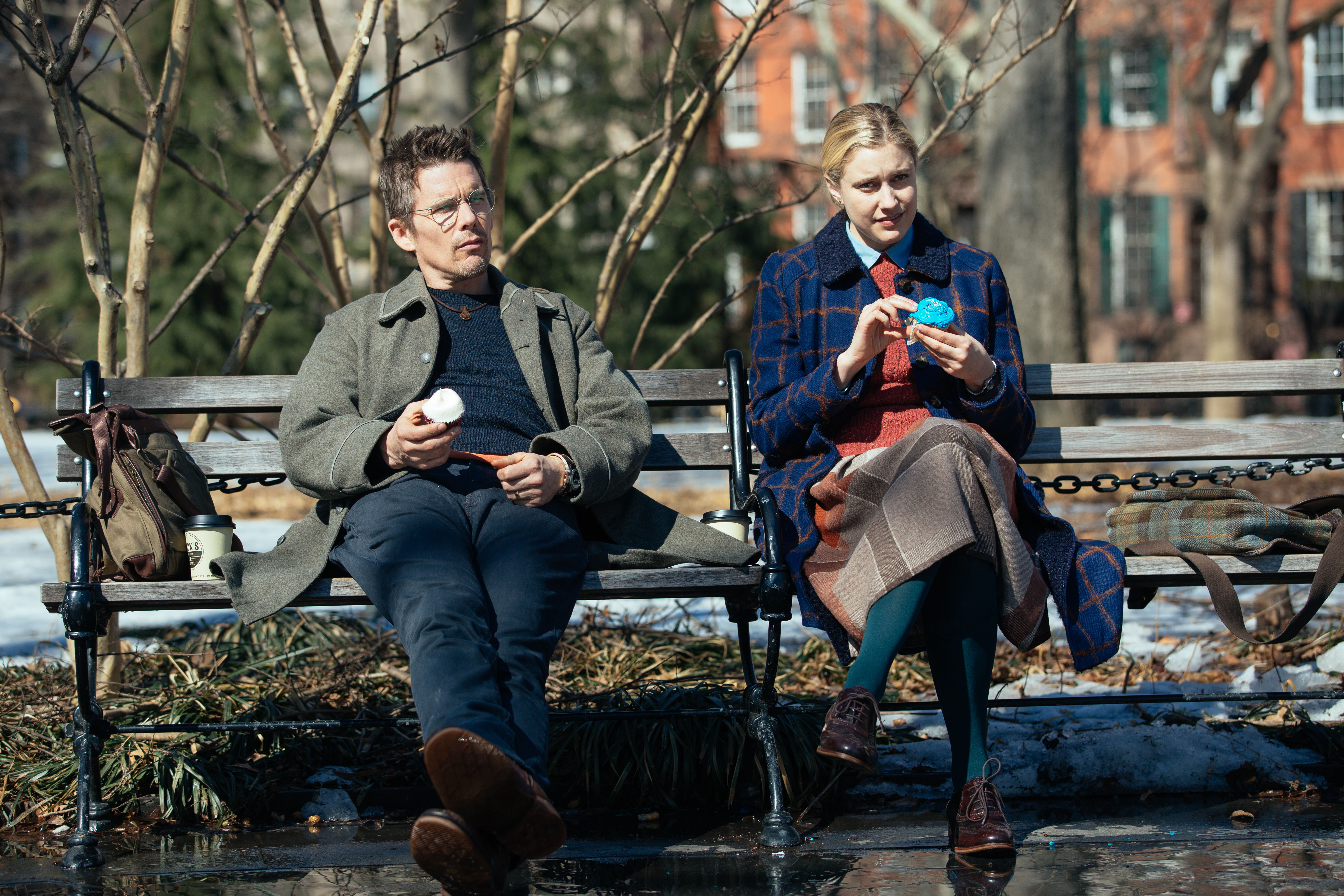 Ethan Hawke and Greta Gerwig sitting on a park bench HD Wallpaper