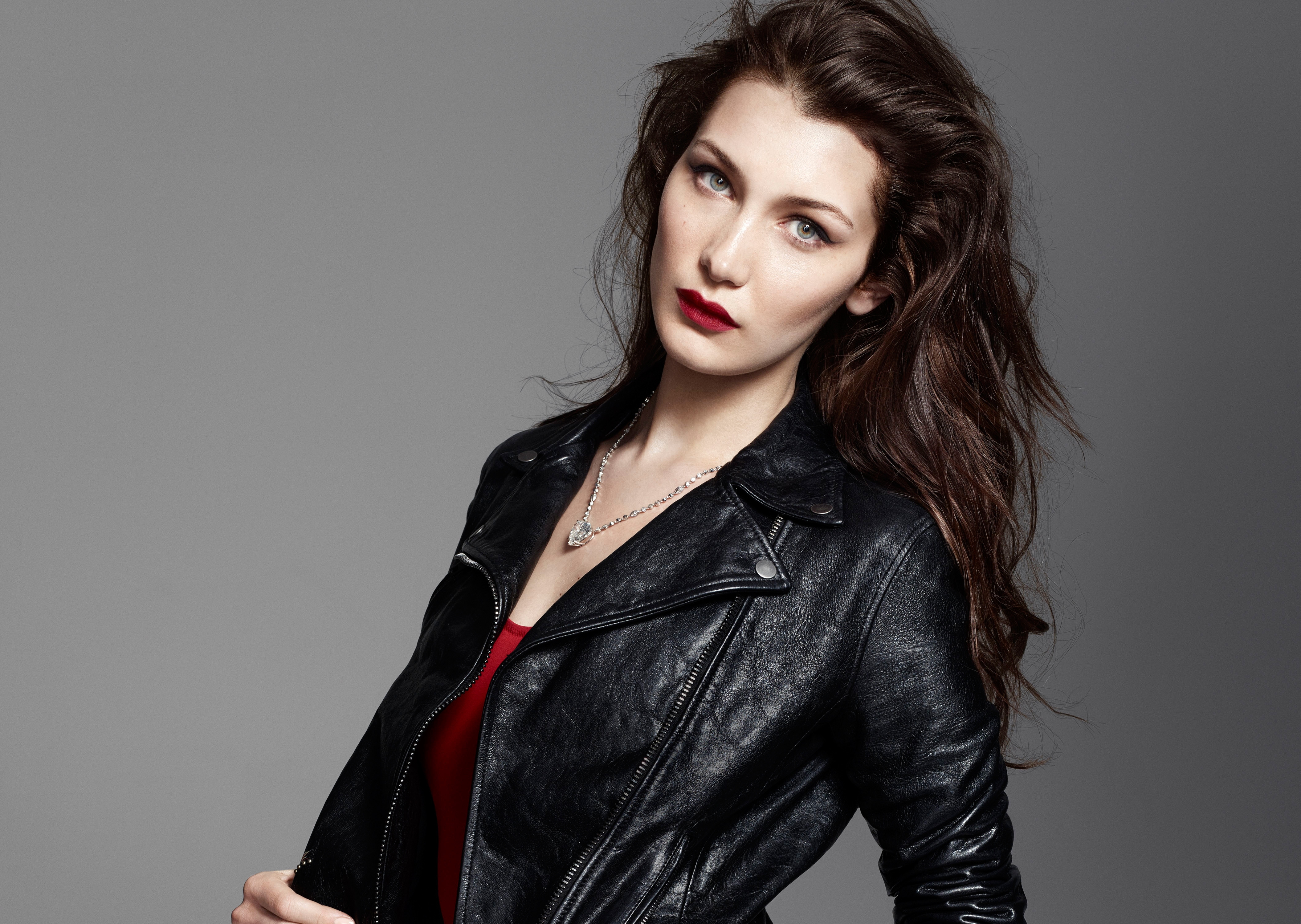 Bella Hadid in a black leather jacket HD Wallpaper