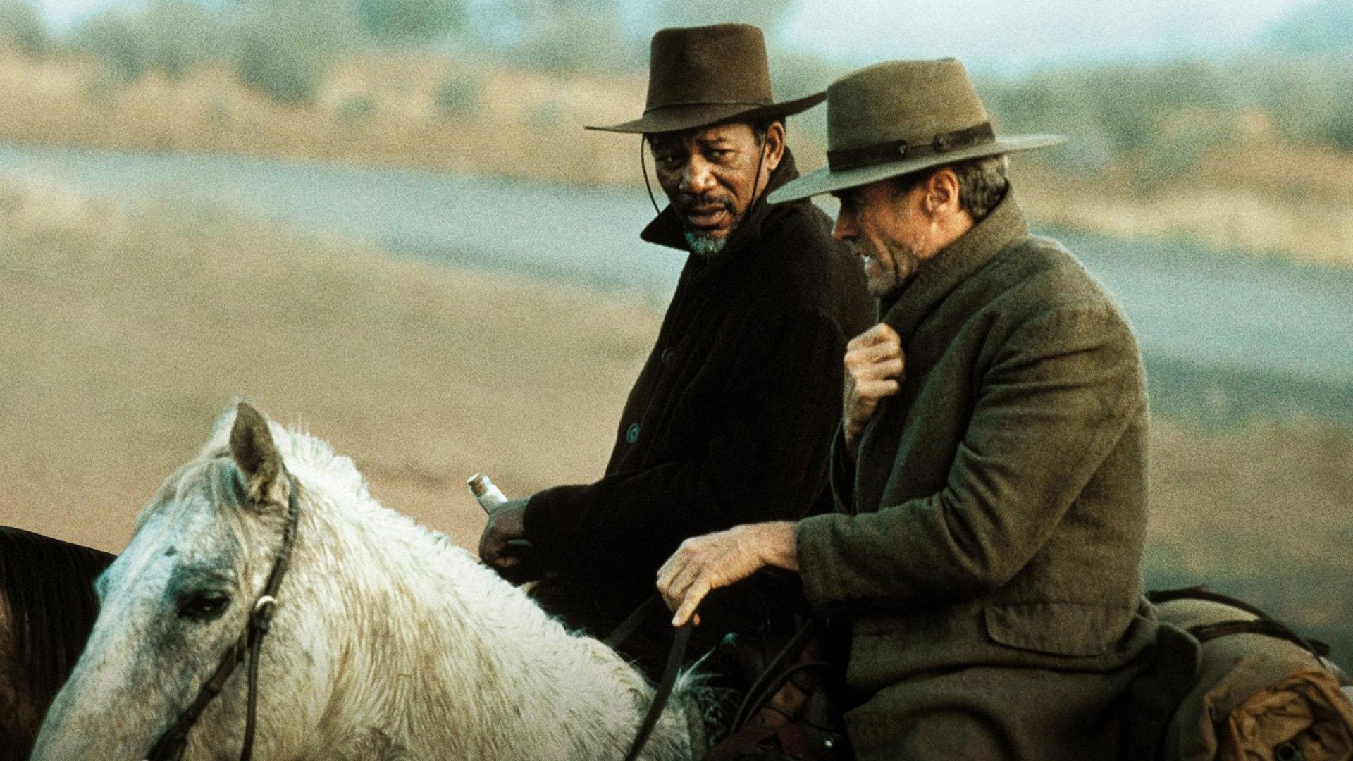 Morgan Freeman and Clint Eastwood on horseback HD Wallpaper