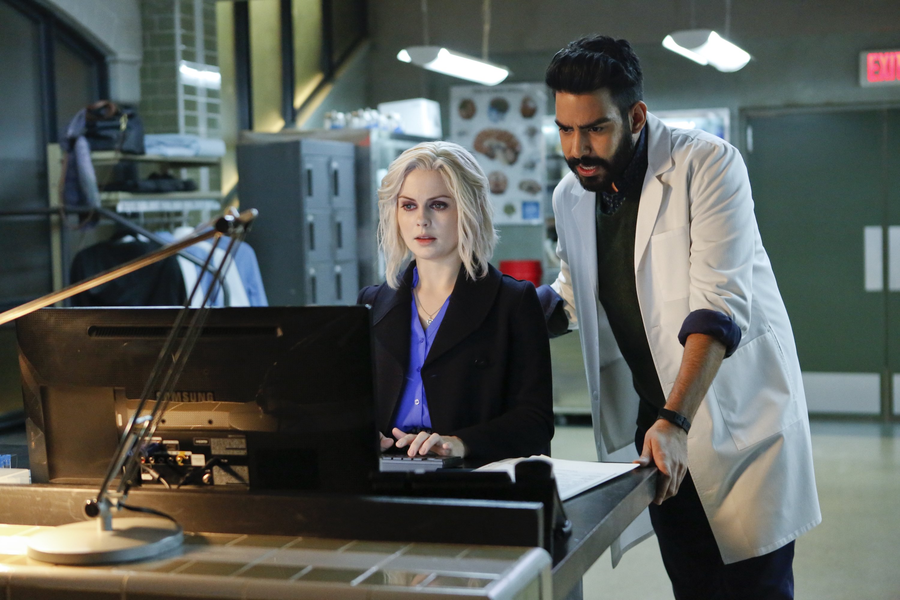 Rose McIver and Rahul Kohli in a laboratory HD Wallpaper