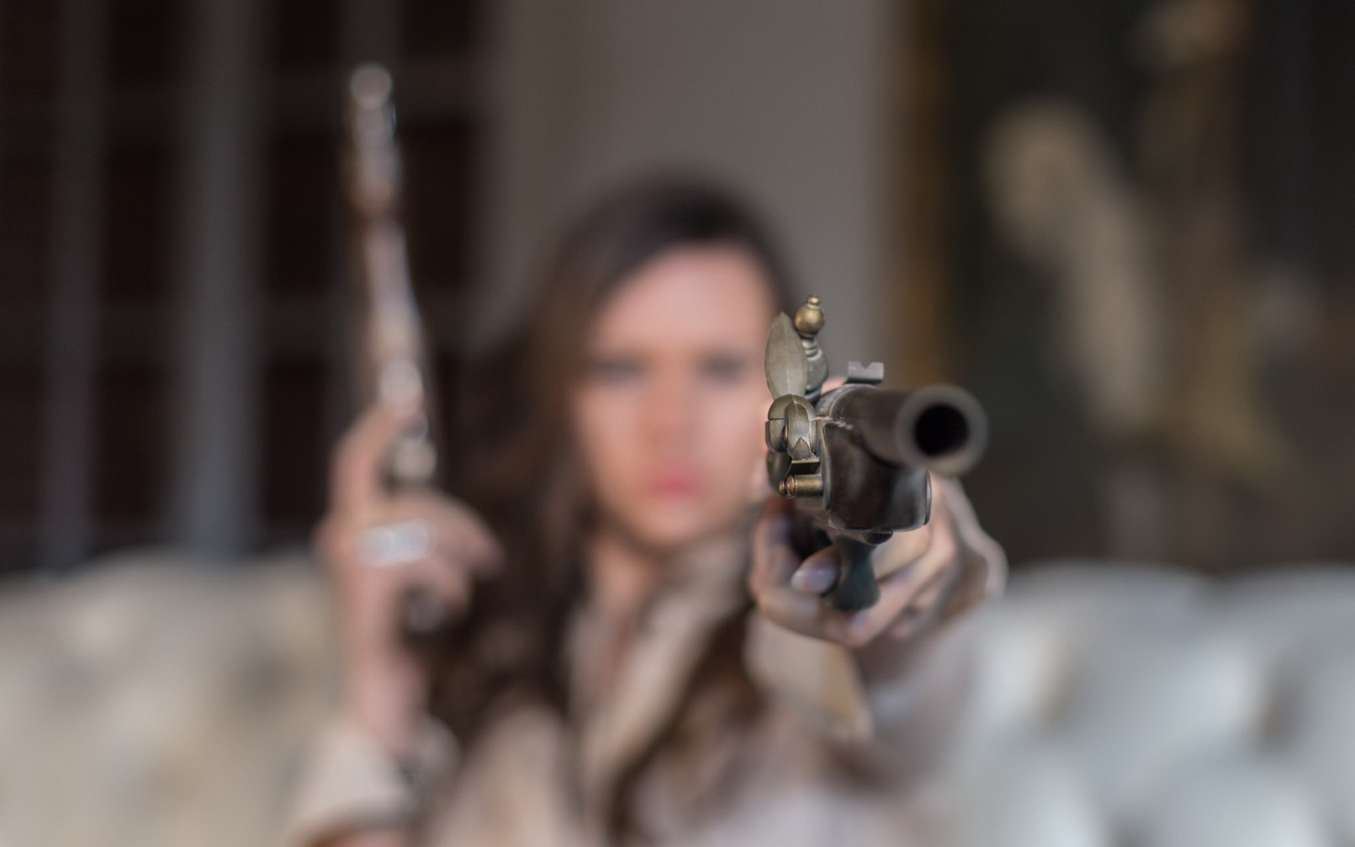 Woman aiming two antique pistols HD Wallpaper