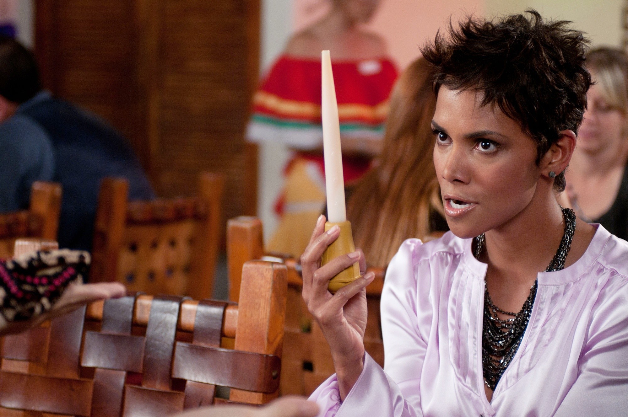 Halle Berry holding a candle HD Wallpaper