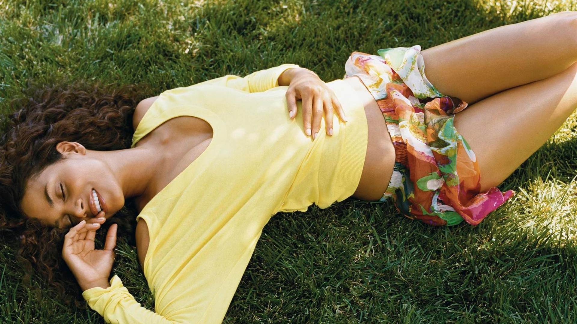 Halle Berry lying on grass HD Wallpaper