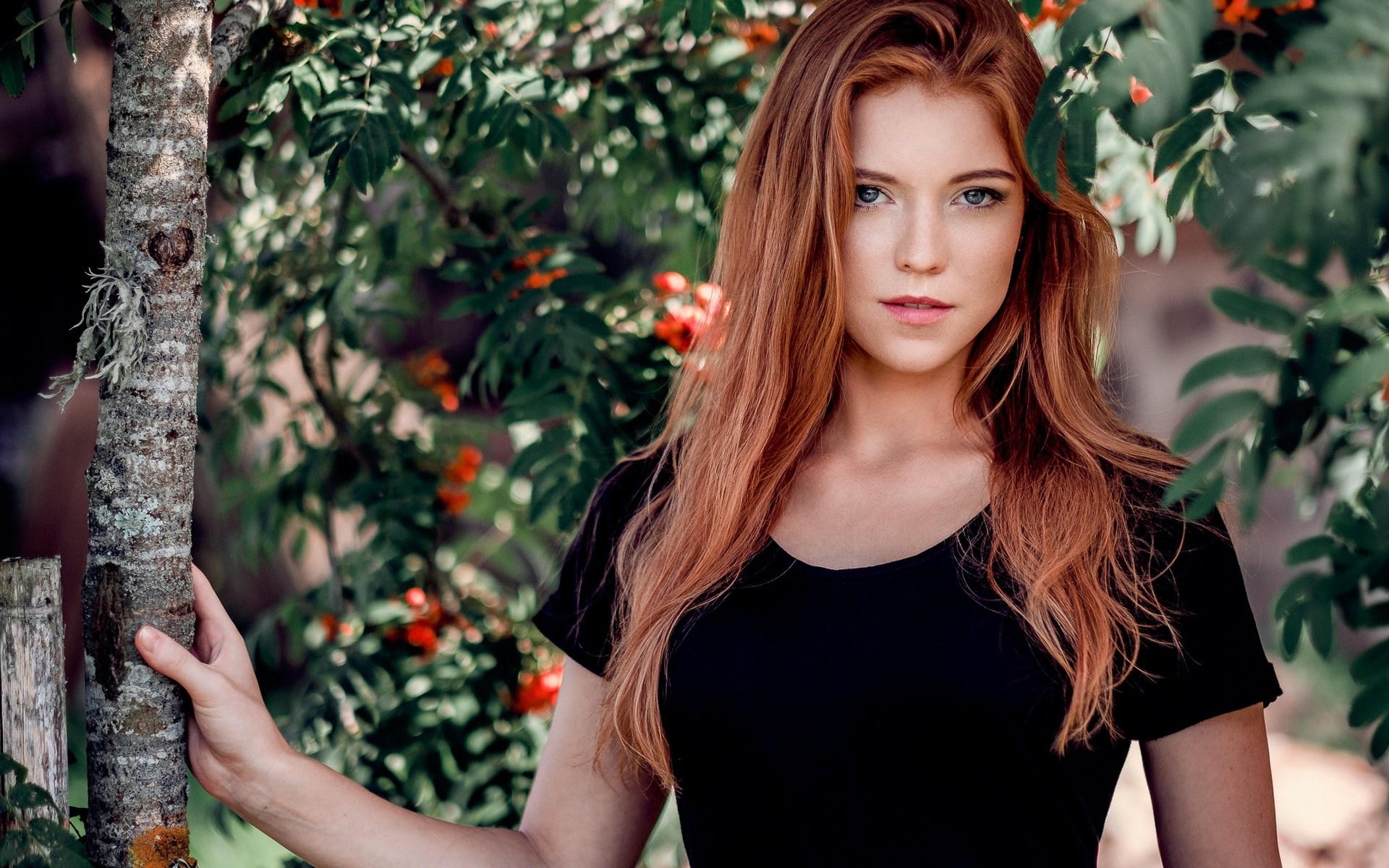 Woman with red hair in a black shirt outdoors HD Wallpaper