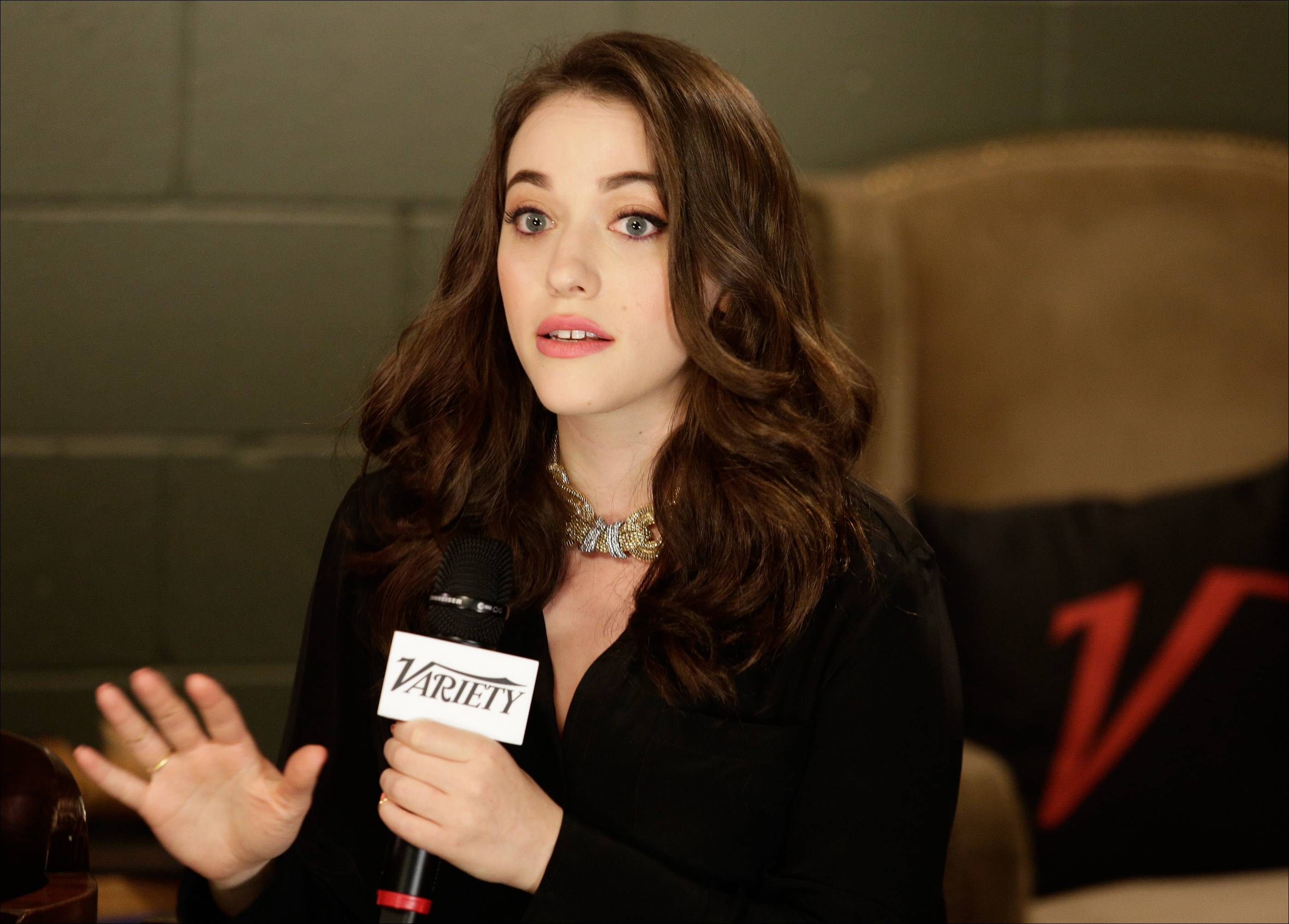 Kat Dennings holding a Variety microphone HD Wallpaper