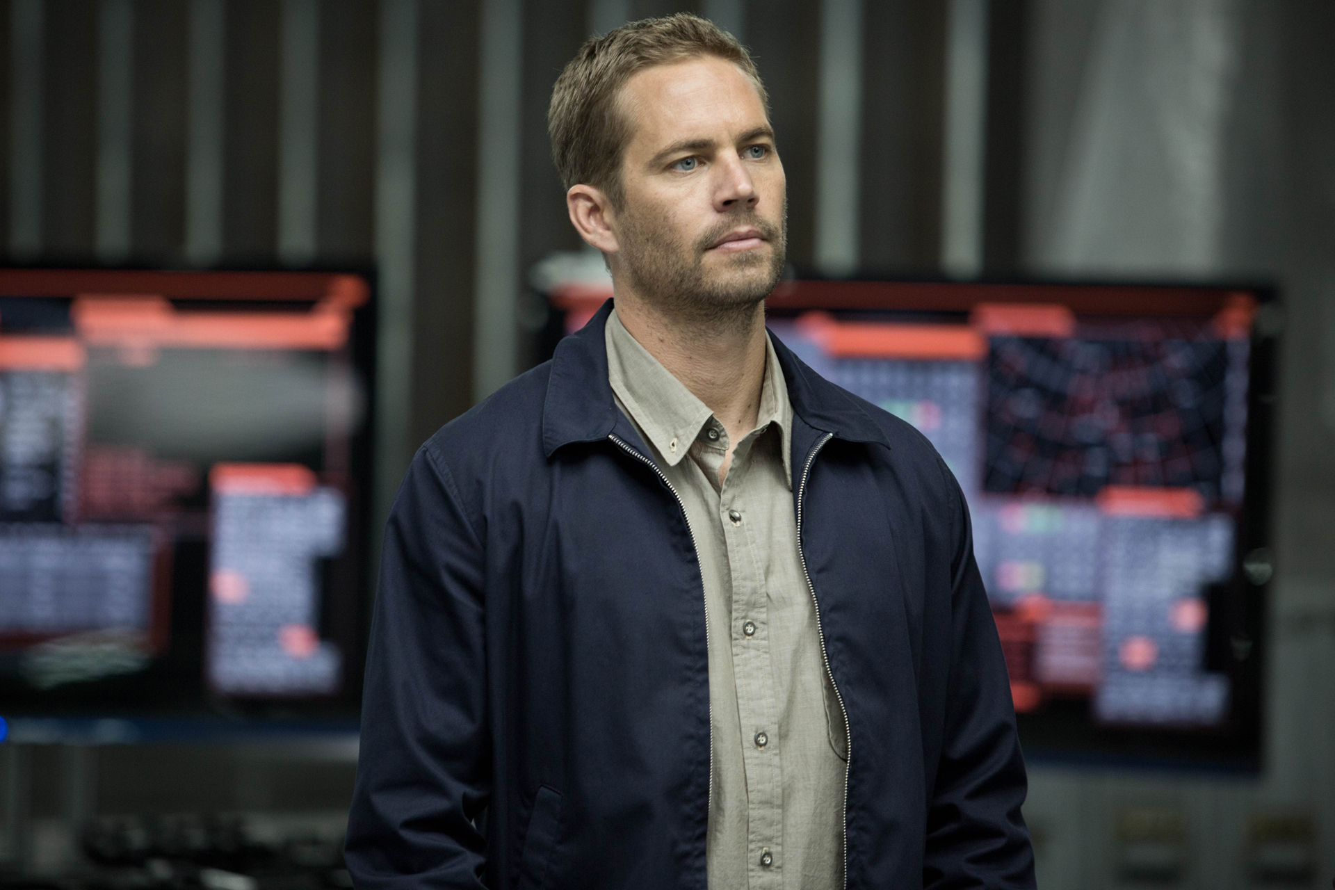 Paul Walker in a dark room with monitors HD Wallpaper