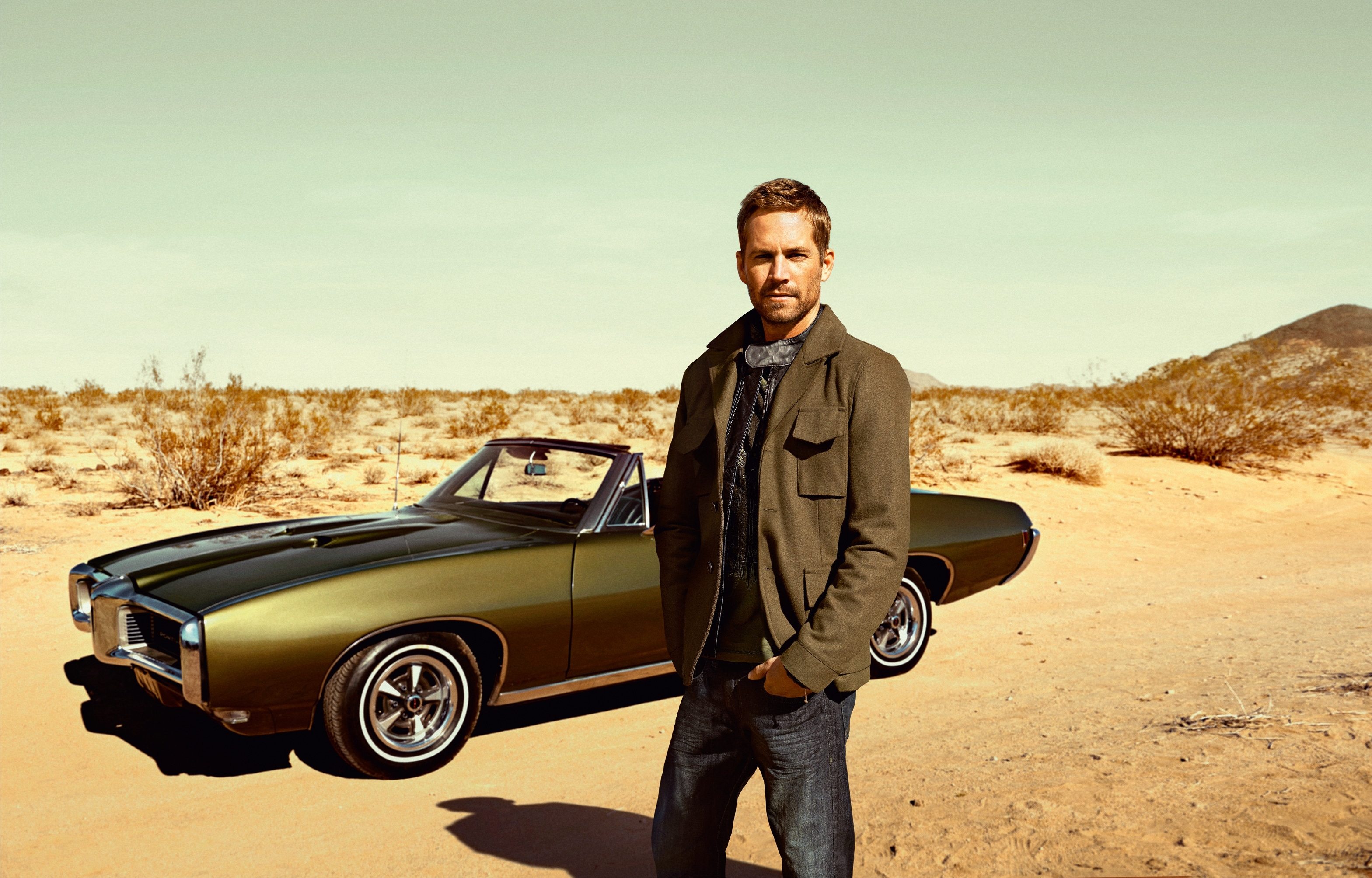 Paul Walker with a vintage convertible car in the desert HD Wallpaper